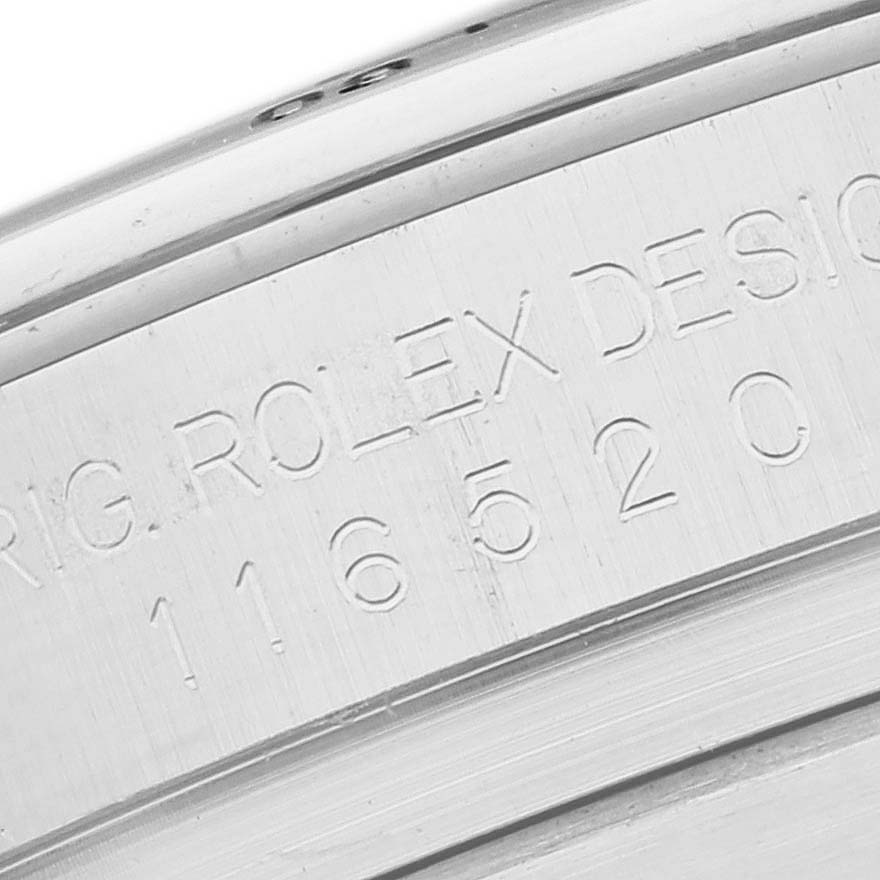 The image shows a close-up of the engraved serial number and model details on the side of a Rolex Daytona 116520 Men's Stainless Steel White Dial 116520 Men's Stainless Steel White Dial watch case.