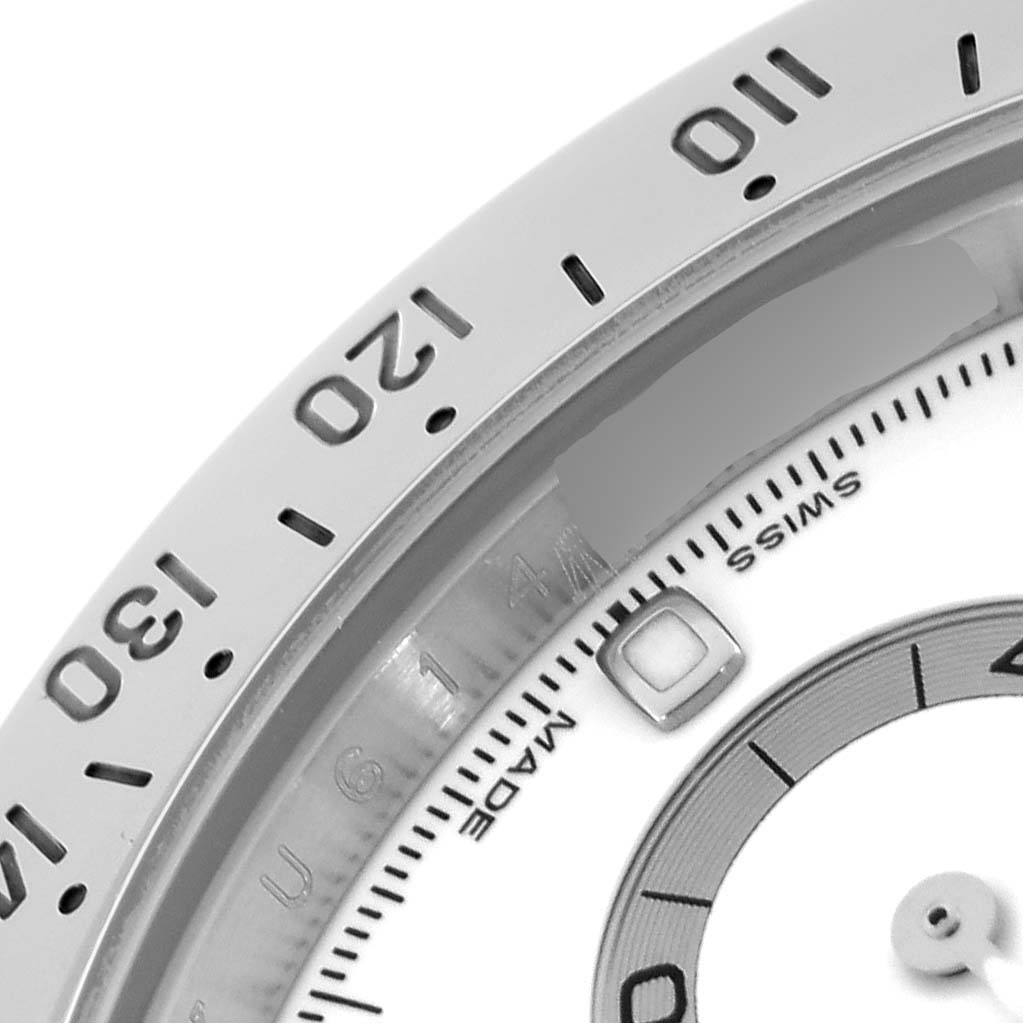 The image shows a close-up of the bezel and outer dial of a Rolex Daytona 116520 Men's Stainless Steel White Dial 116520 Men's Stainless Steel White Dial watch.