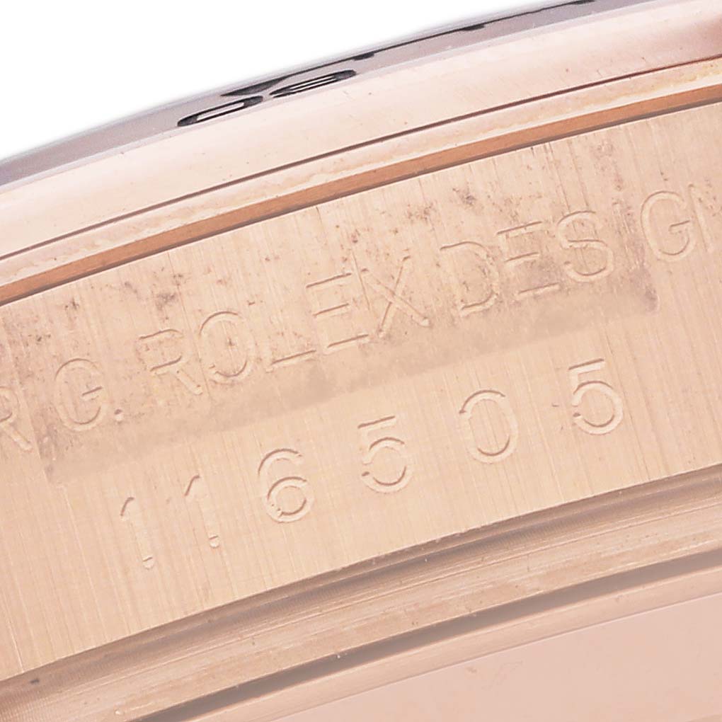 The image shows a close-up of the Rolex Daytona 116505 Men
s Rose Gold Black Dial 116505 Men
s Rose Gold Black Dial model
s inner case with engraved text and model number.