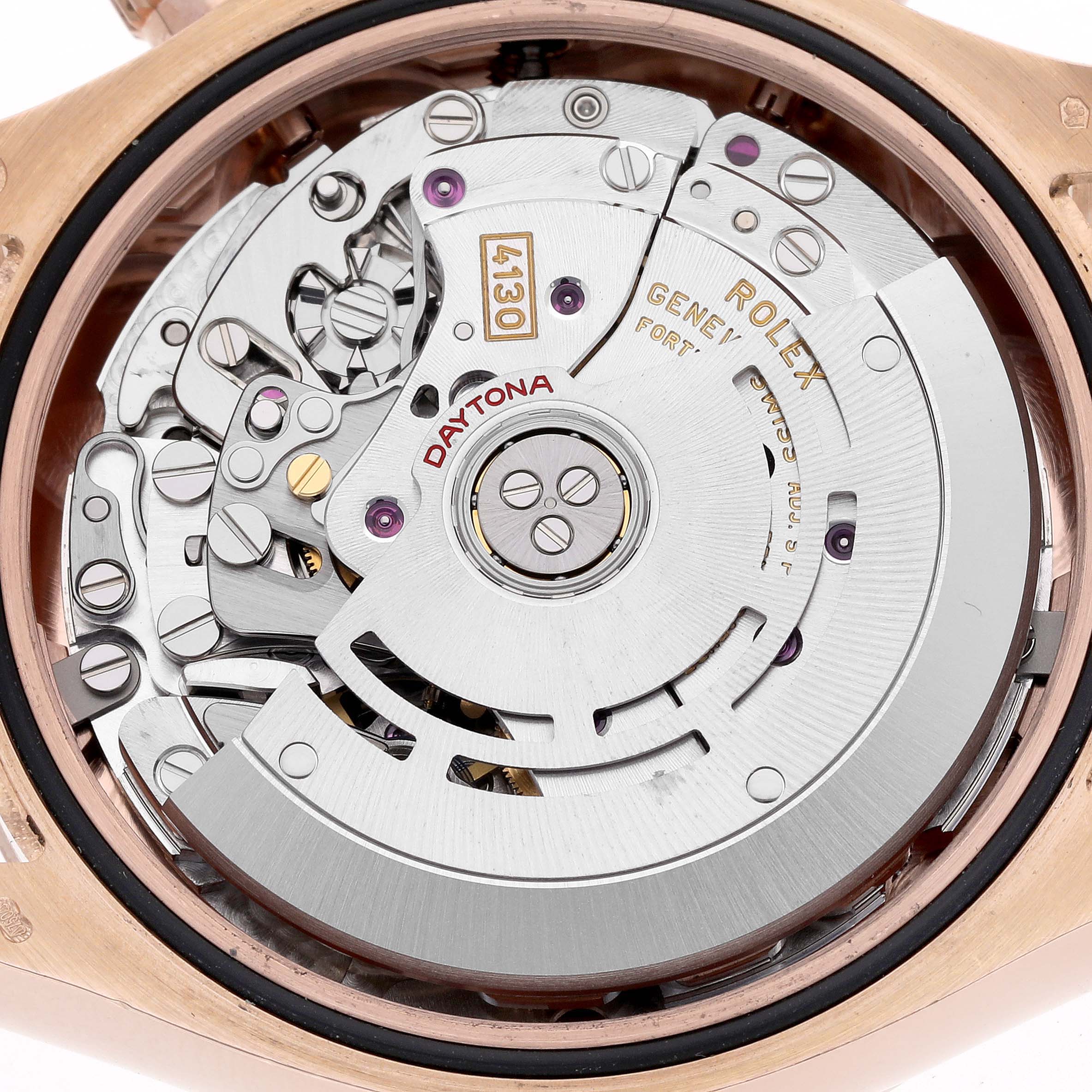 The image shows the movement of a Rolex Daytona 116505 Men
s Rose Gold Black Dial 116505 Men
s Rose Gold Black Dial watch from the back, highlighting the inner mechanics.