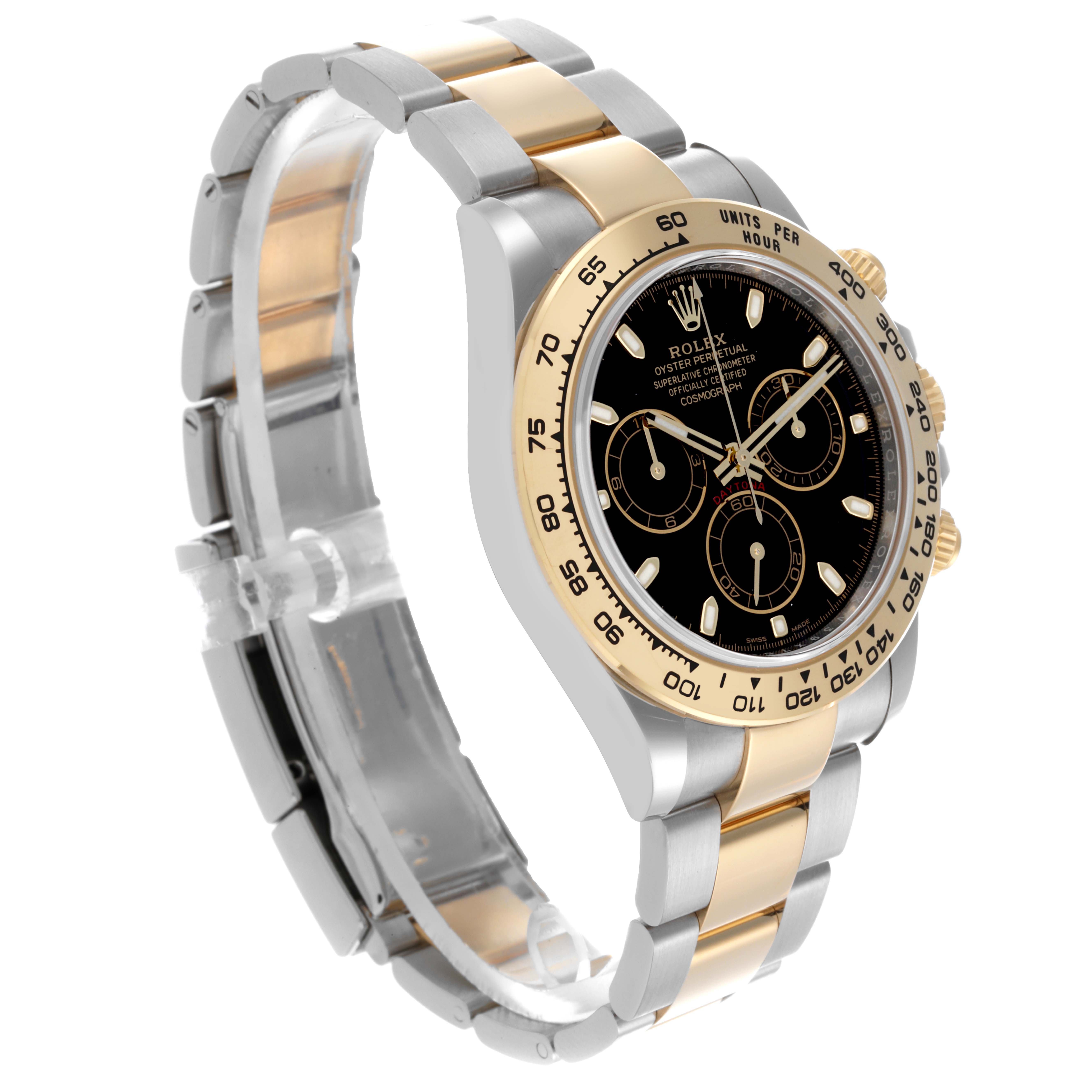 The Rolex Daytona 116503-0004 Men's Steel and Gold (two tone) Black Dial 116503-0004 Men's Steel and Gold (two tone) Black Dial watch is shown from a left side angle, highlighting its bezel, dial, and bracelet.