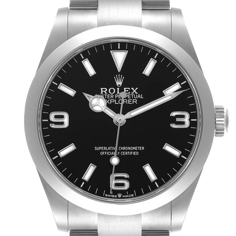 The Rolex Explorer watch is shown from a straight-on angle, displaying the dial, bezel, and part of the bracelet.