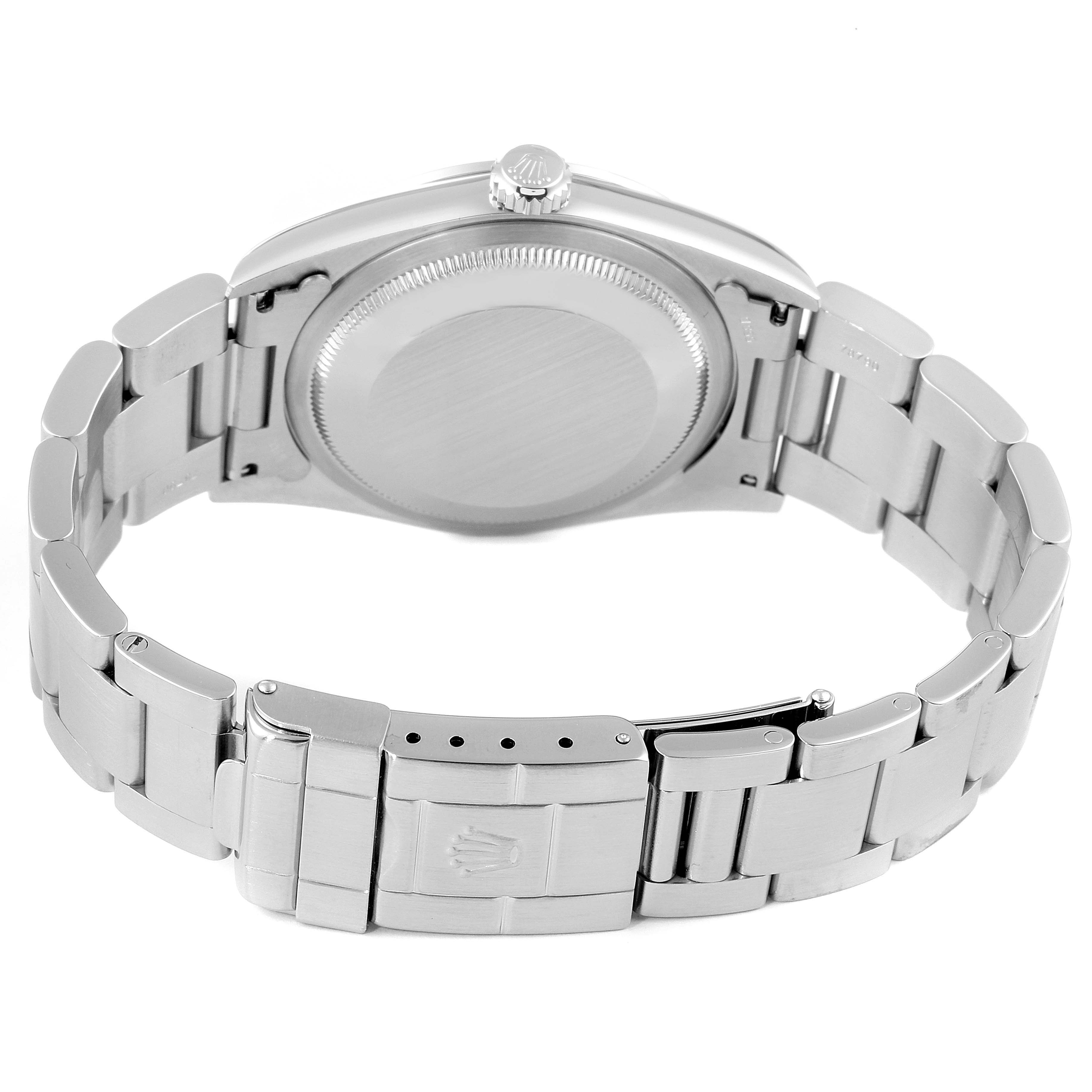 The image shows the back of the Rolex Explorer 14270 Men
s Stainless Steel Black Dial 14270 Men
s Stainless Steel Black Dial model, highlighting its case back, crown, and metal bracelet with the clasp open.