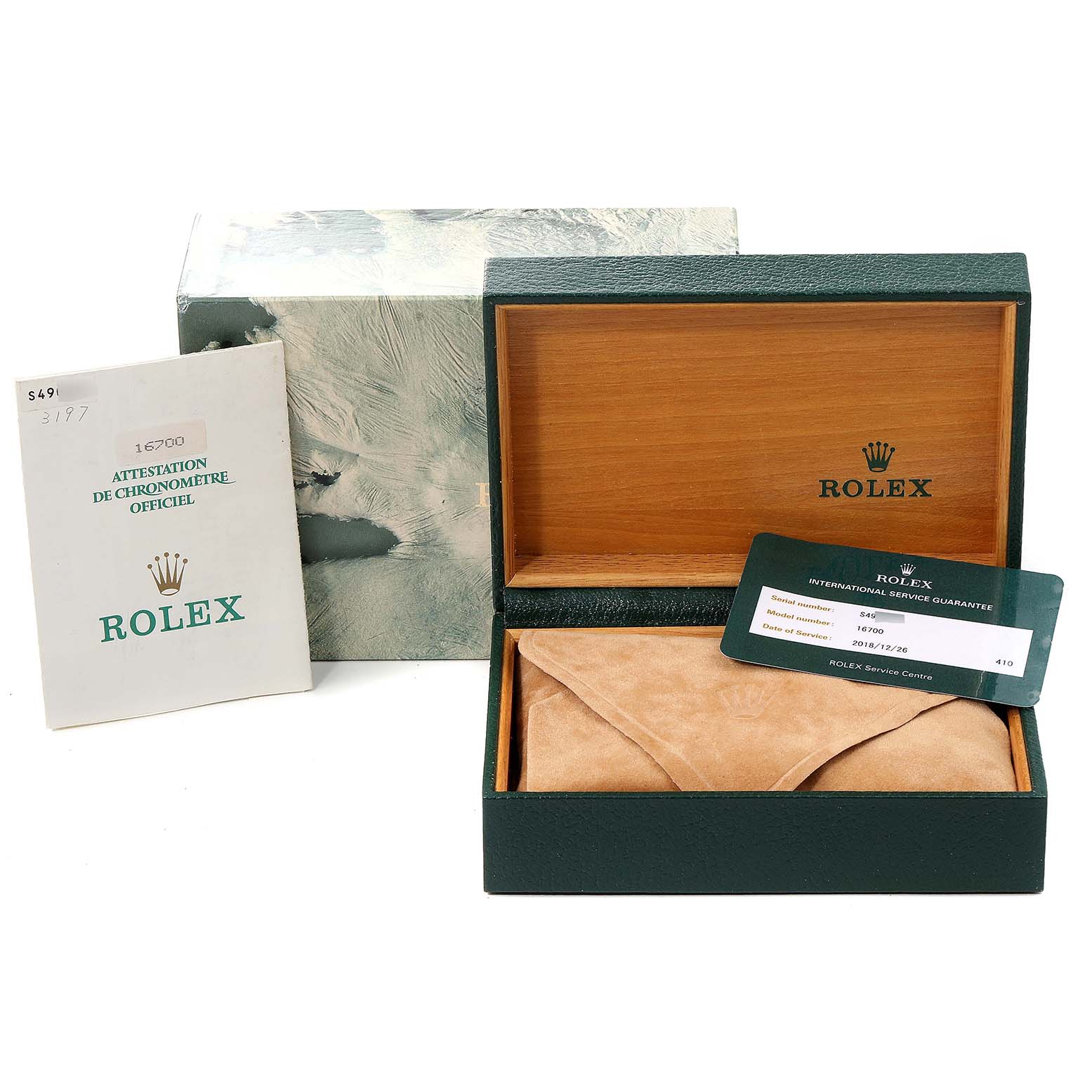 The image shows an open Rolex GMT-Master 16700 Men's Stainless Steel Black Dial 16700 Men's Stainless Steel Black Dial watch box, including paperwork and an international guarantee card.