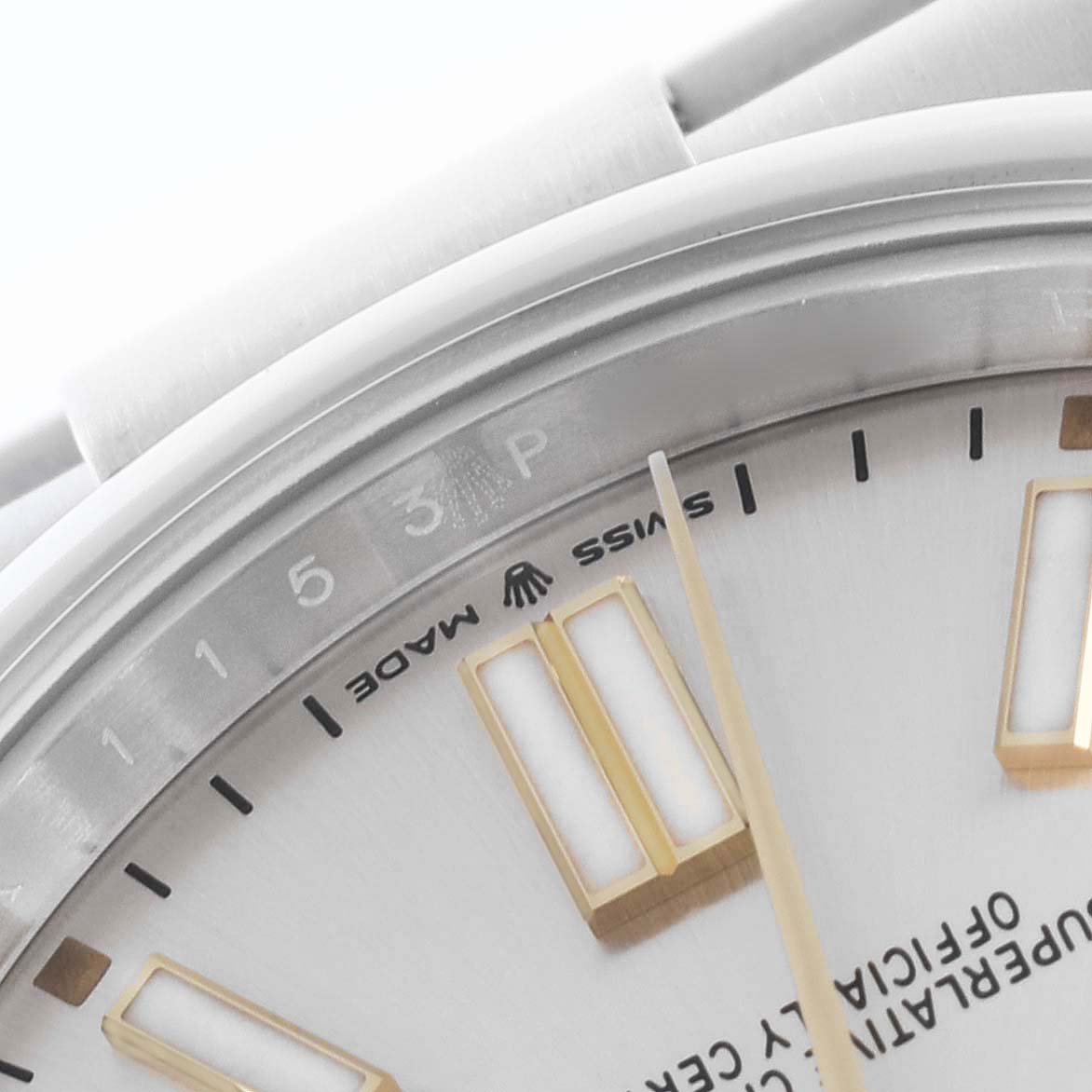 The image shows a close-up of the dial and part of the bezel of a Rolex Oyster Perpetual 124300 Men's Stainless Steel Silver Dial 124300 Men's Stainless Steel Silver Dial watch, highlighting hour markers and text.