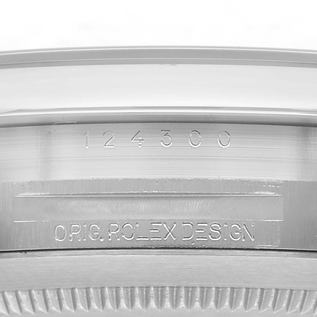 The image shows an engraved side view of the Rolex Oyster Perpetual 124300 Men's Stainless Steel Silver Dial 124300 Men's Stainless Steel Silver Dial, highlighting the serial number and "ORIG ROLEX DESIGN."