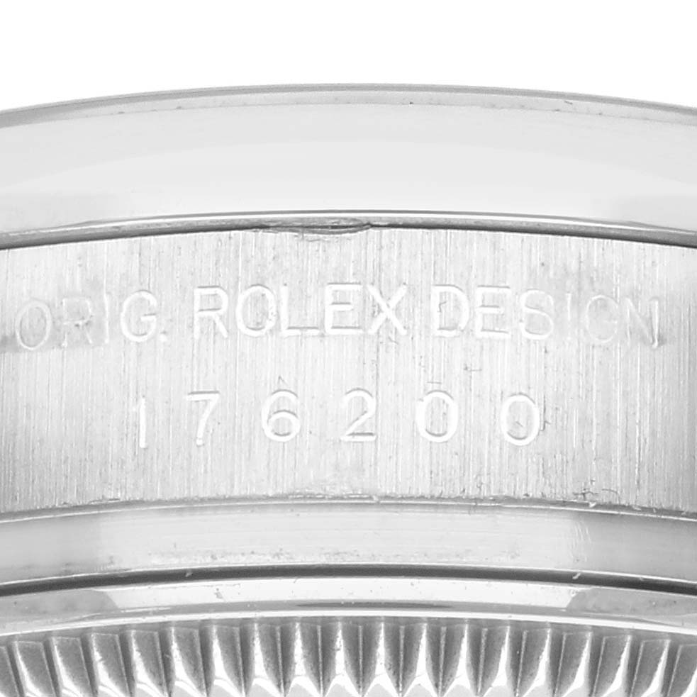 The image shows the side view of the bezel and case with engraving of the Oyster Perpetual Rolex model.