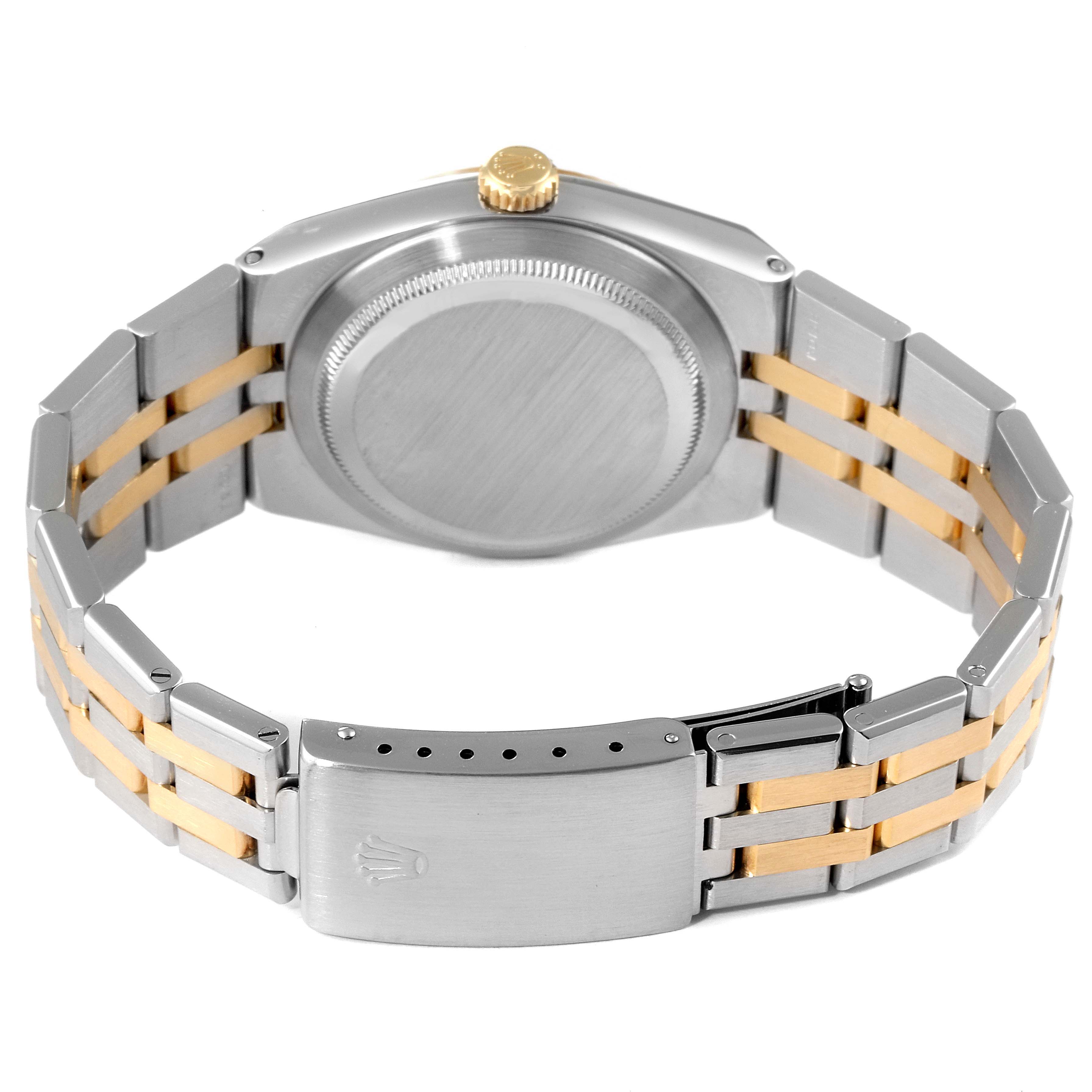 The image shows the back angle of a Rolex Oysterquartz 17013 Men's Steel and Gold (two tone) Champagne Dial 17013 Men's Steel and Gold (two tone) Champagne Dial watch, highlighting the stainless steel and gold bracelet and the closed clasp.