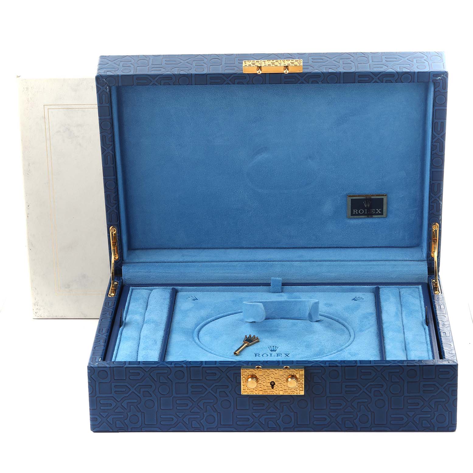 The image shows an open Rolex Pearlmaster 80299 Women's White Gold Mother of Pearl Dial 80299 Women's White Gold Mother of Pearl Dial box, showcasing its blue interior, compartments, and a key.