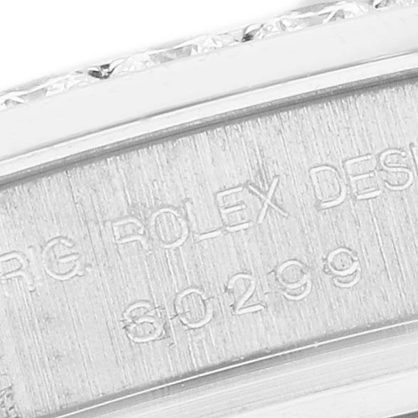 The image shows a detailed side view of a Rolex Pearlmaster 80299 Women's White Gold Mother of Pearl Dial 80299 Women's White Gold Mother of Pearl Dial watch case with engraved markings.