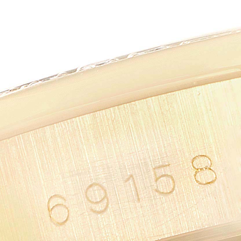 This image shows a close-up of the inner case of a Rolex President 69158 Women's Yellow Gold Champagne Dial 69158 Women's Yellow Gold Champagne Dial model watch, displaying the model number 69158.