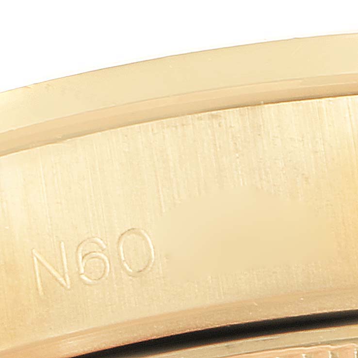 This image shows a close-up angle of the inside of the band of a Rolex President 69158 Women's Yellow Gold Champagne Dial 69158 Women's Yellow Gold Champagne Dial model watch, revealing the engraved "N60".