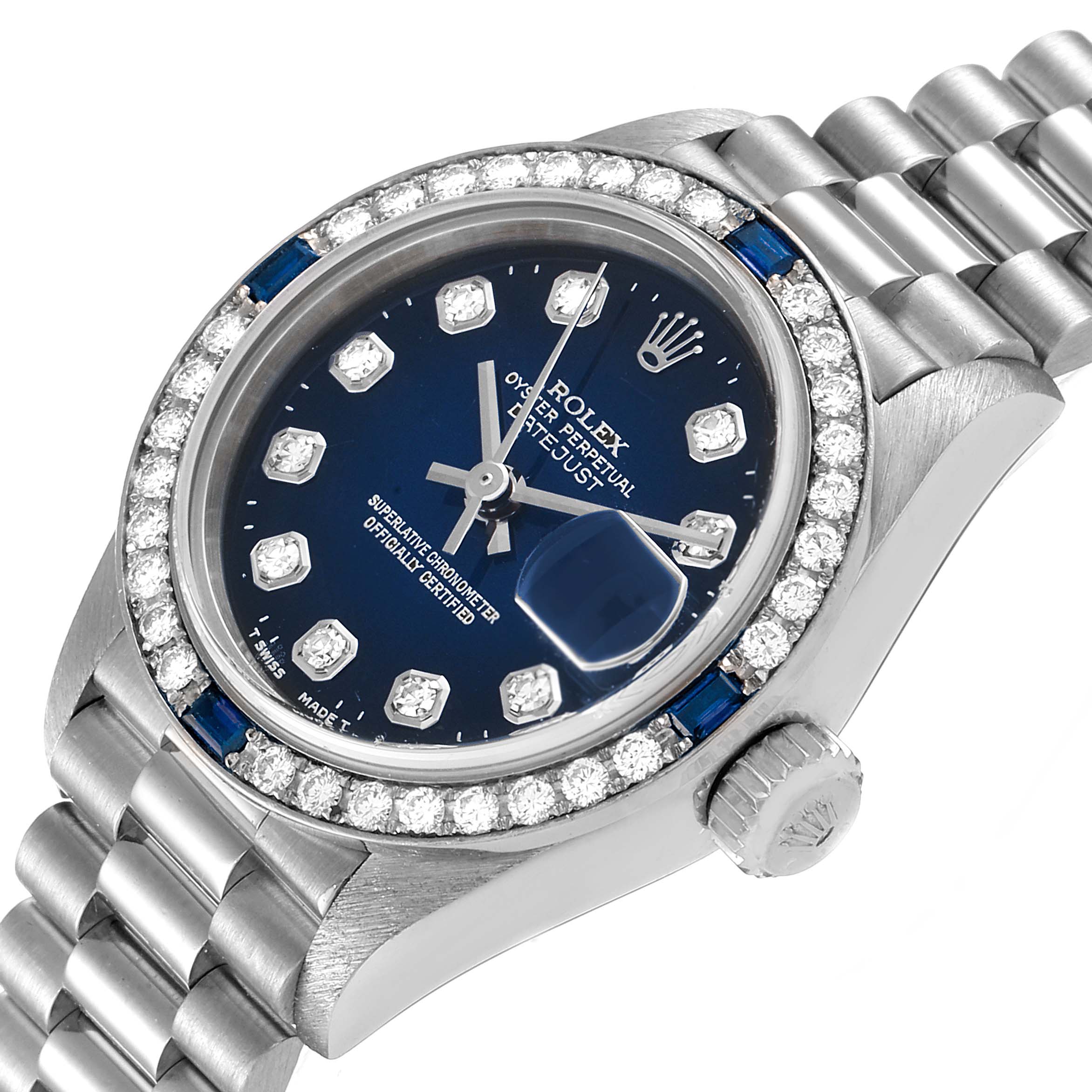 The image shows a close-up angle of the Rolex President 79089 Women's White Gold Blue Dial 79089 Women's White Gold Blue Dial model watch, highlighting its bezel, dial, and part of its bracelet.