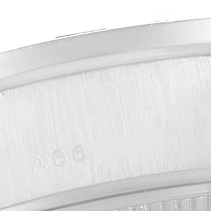 This is a close-up angle of a serial number engraved on the side of a Rolex President 79089 Women's White Gold Blue Dial 79089 Women's White Gold Blue Dial watch.