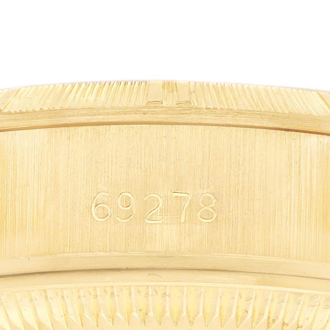 The image shows a close-up side view of the Rolex President 69278 Women's Yellow Gold Champagne Dial model, focusing on its gold case with visible engravings.