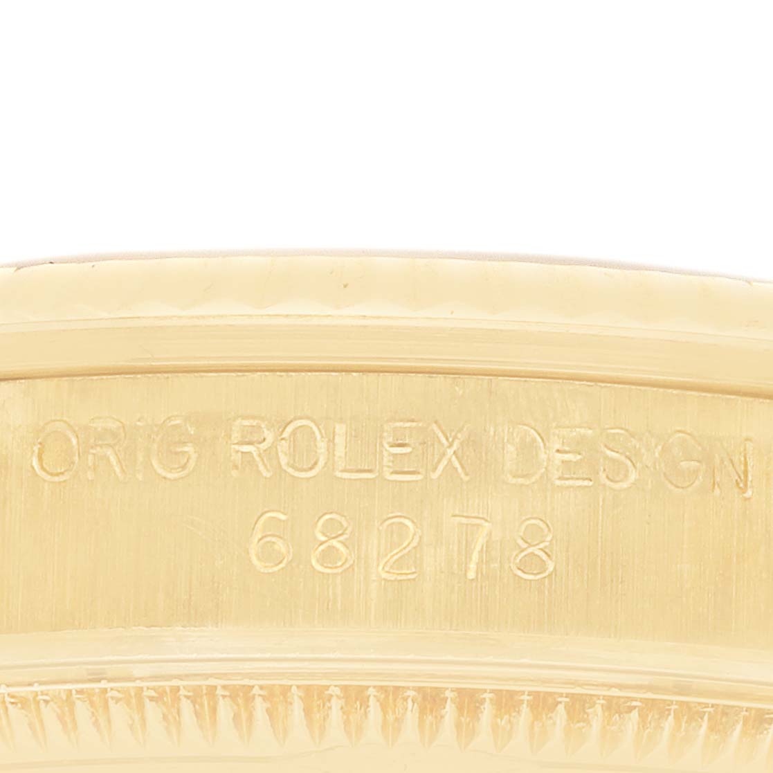 The image shows a close-up of the inner side with the engraving "ORIG ROLEX DESIGN 68278" on the Rolex President 68278 Women's Yellow Gold Champagne Dial watch.