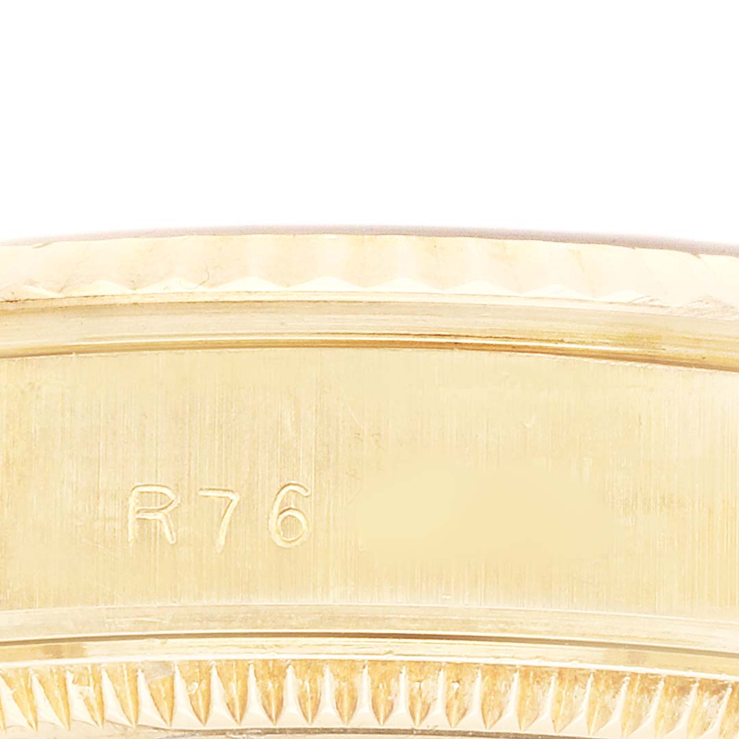 The image shows a close-up of the Rolex President 68278 Women's Yellow Gold Champagne Dial model's case side, featuring the serial engraving.