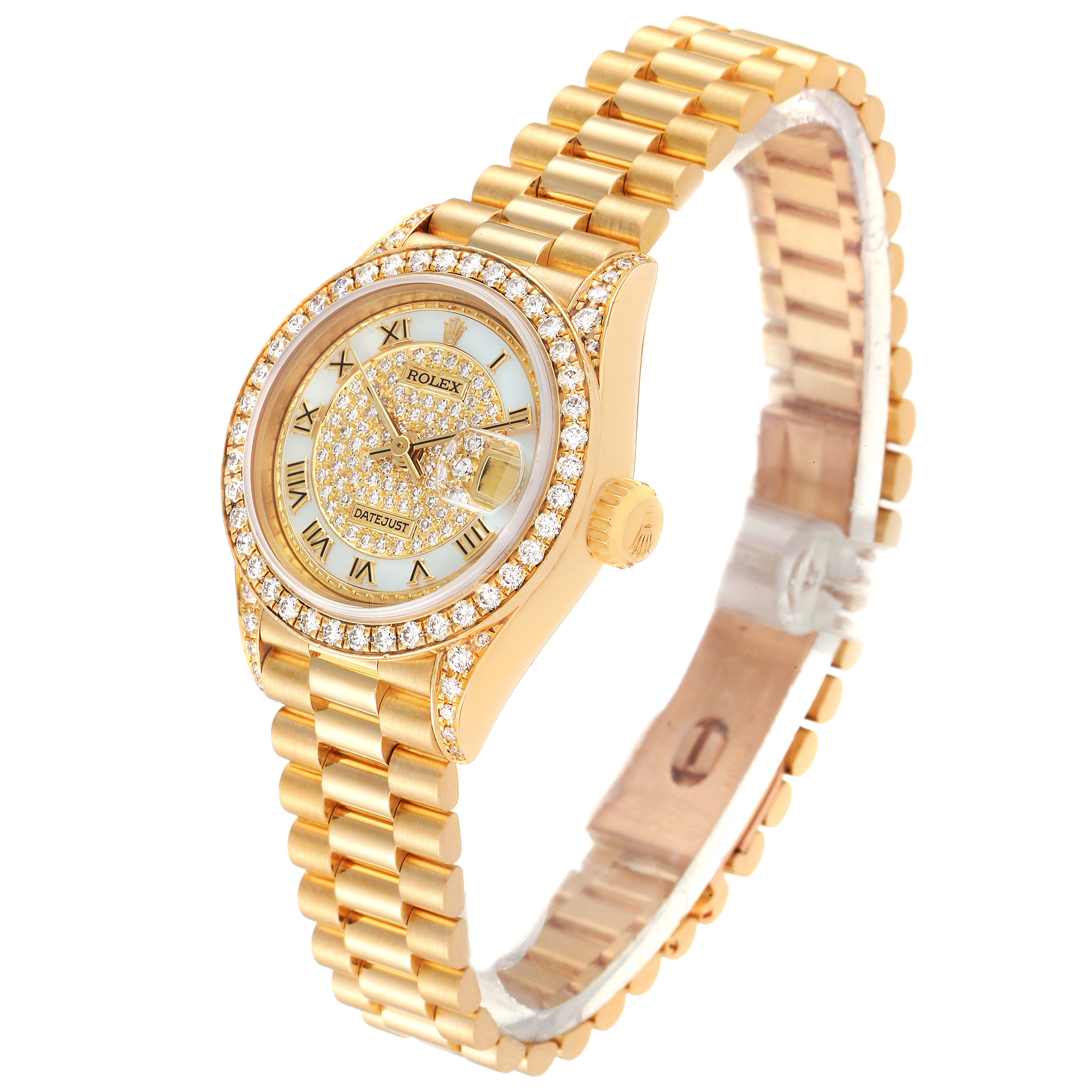 The image shows a Rolex President 69158 Women
s Yellow Gold Mother of Pearl Dial 69158 Women
s Yellow Gold Mother of Pearl Dial model watch at an angled view displaying the face, bezel, crown, and bracelet.