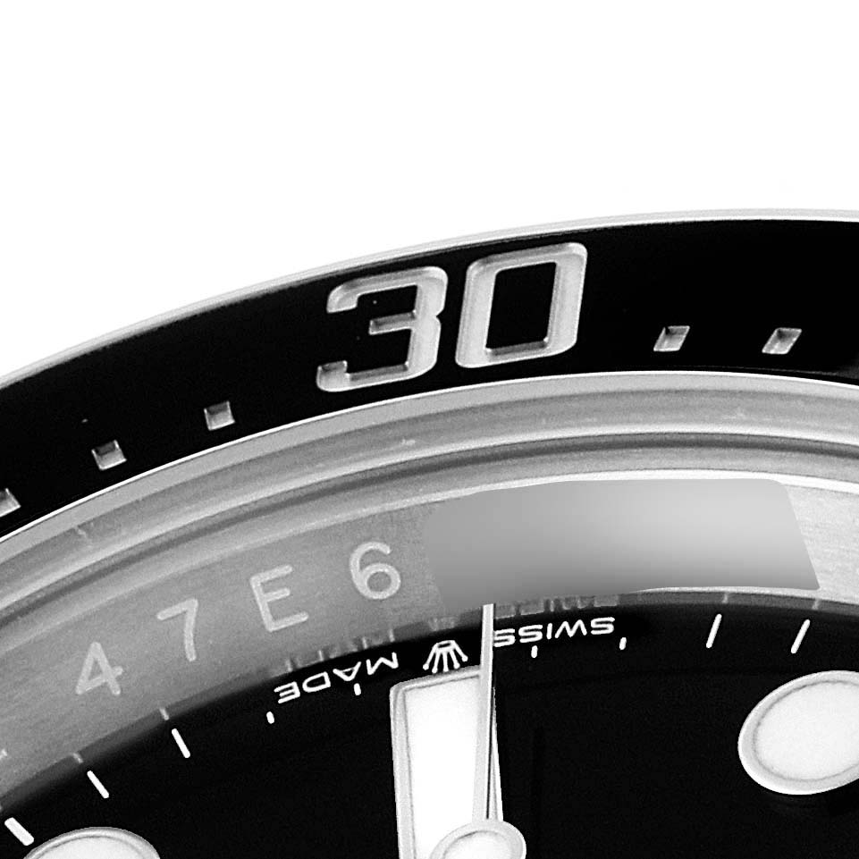This image shows a close-up of the bezel with the 30-minute marker, part of the dial, and the hands of the Rolex Sea-Dweller 126600 Men
s Stainless Steel Black Dial 126600 Men
s Stainless Steel Black Dial watch.