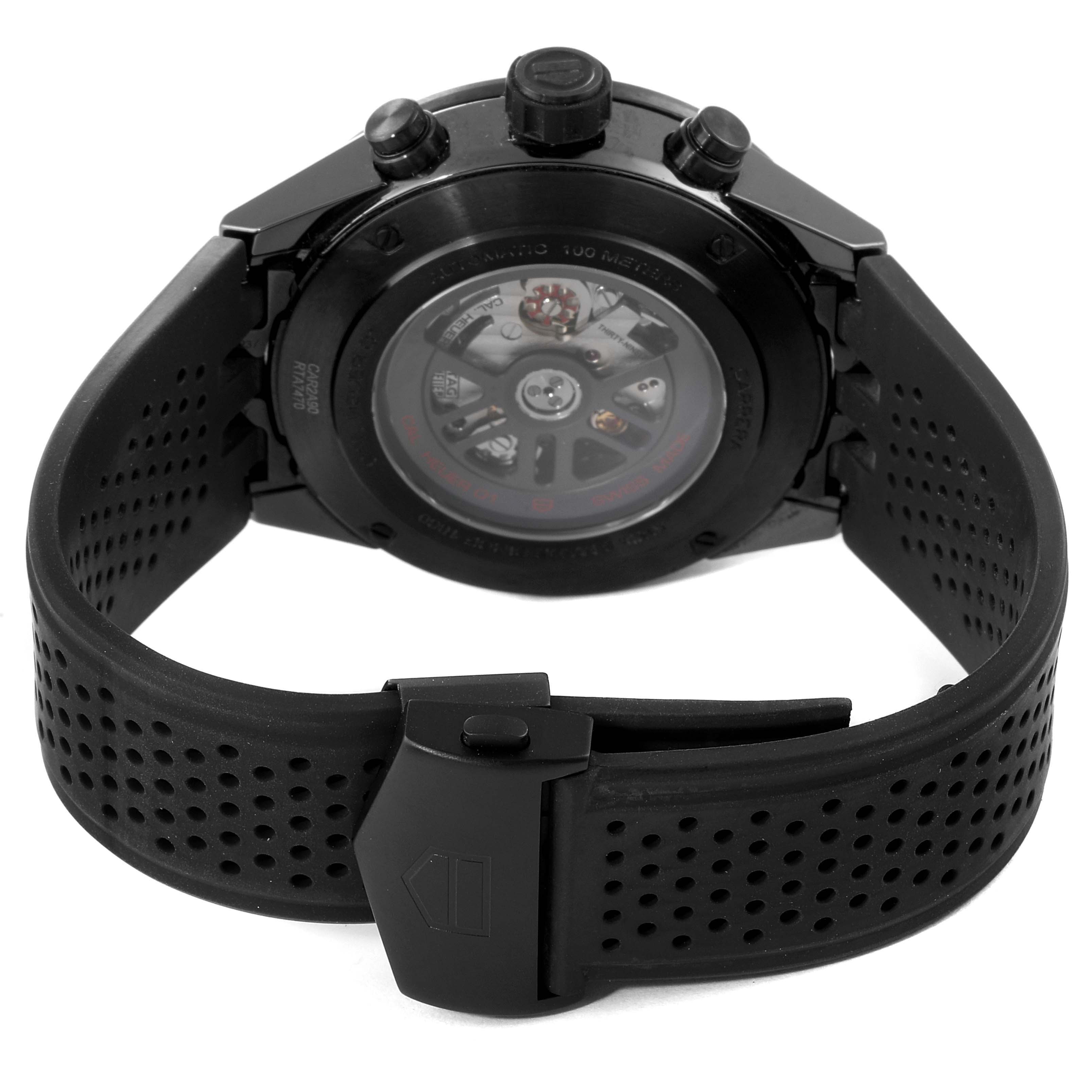 The image shows the back view of a Tag Heuer Carrera CAR2A90.FT6071 Men's Ceramic Black Dial CAR2A90.FT6071 Men's Ceramic Black Dial watch, highlighting its transparent case back and perforated rubber strap.