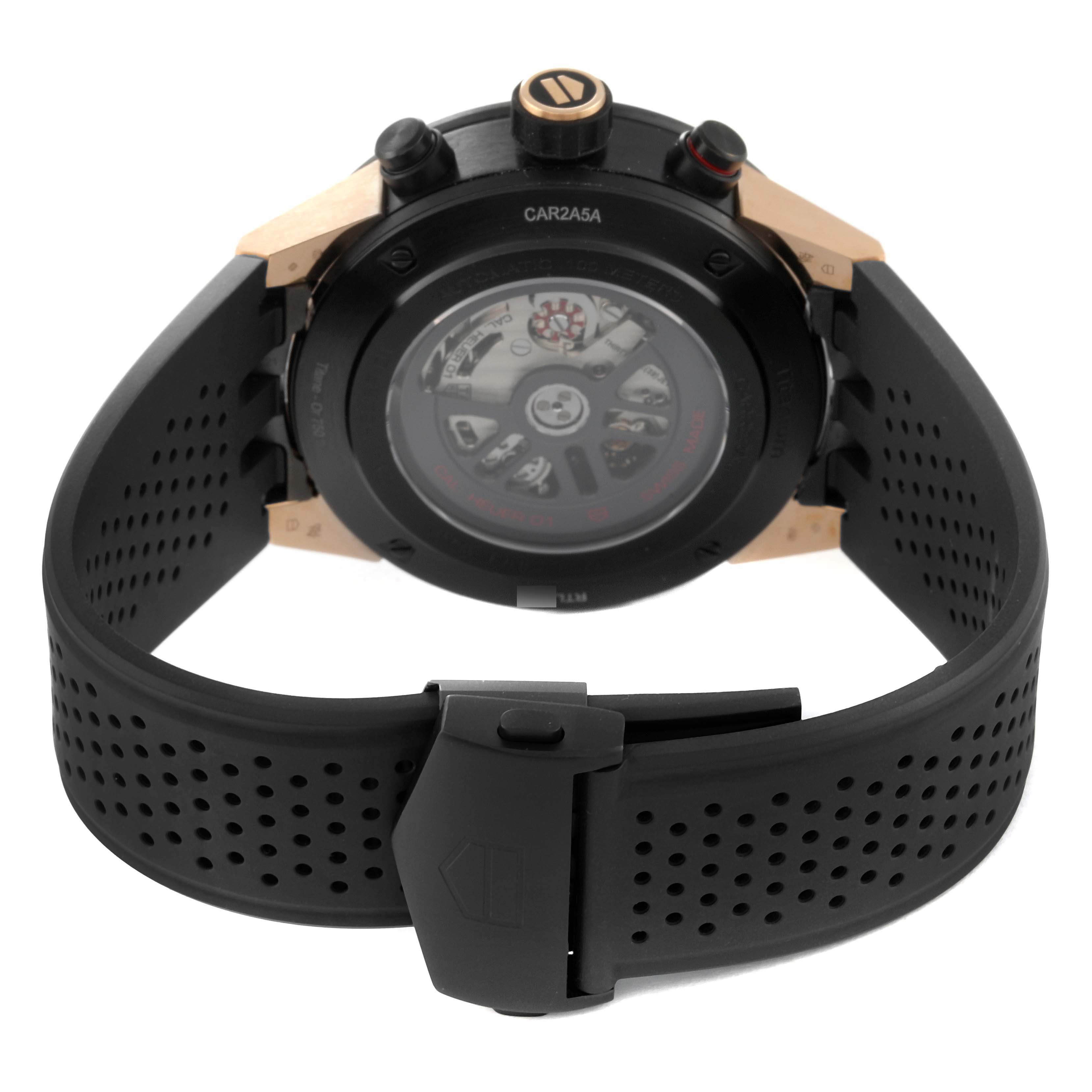 The image shows the back and clasp of a Tag Heuer Carrera CAR2A5A Men's Titanium Transparent Dial CAR2A5A Men's Titanium Transparent Dial watch with a black perforated strap.