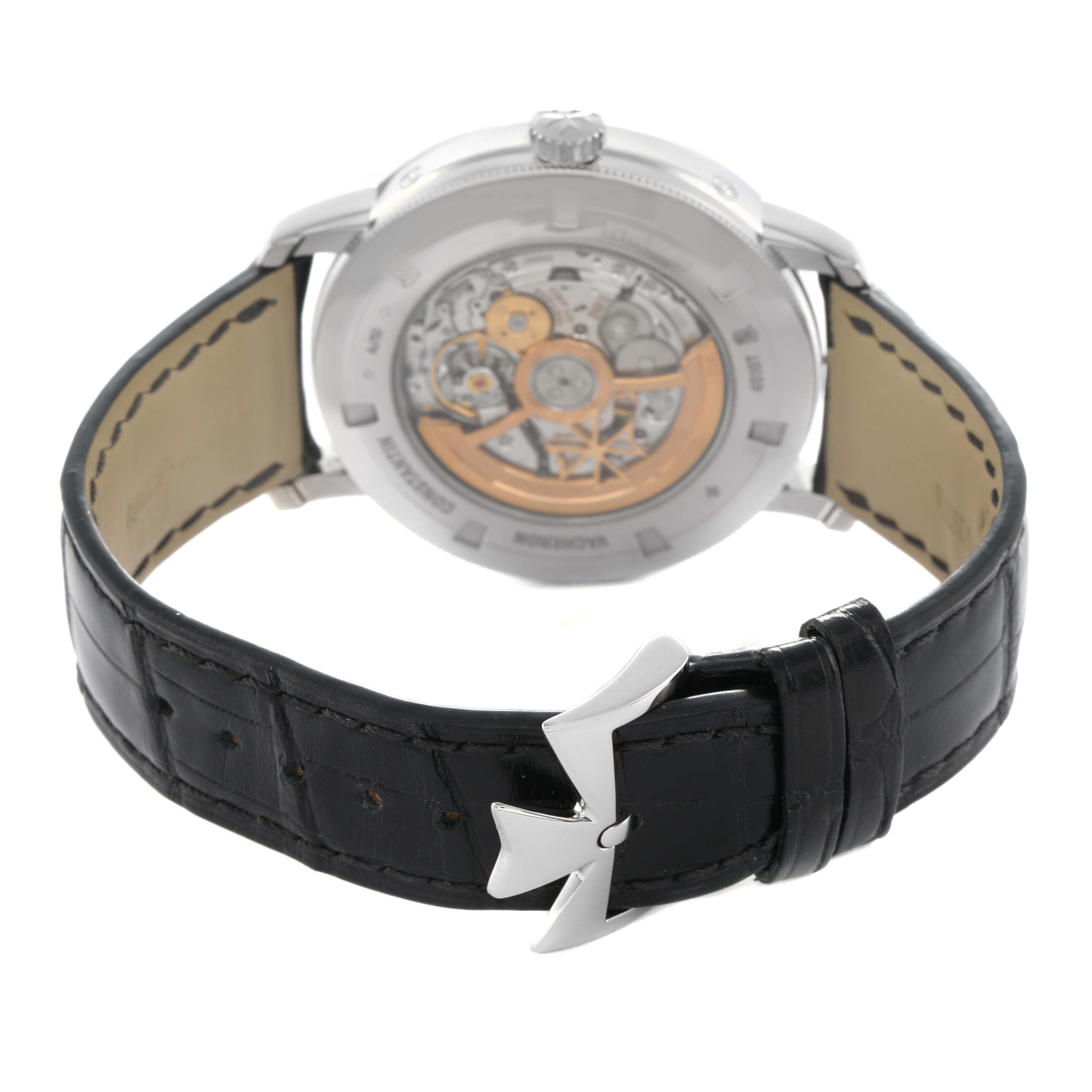 The Vacheron Constantin Traditionnelle 4010T/000G-B740 Men's White Gold Grey Dial watch is shown from the back, featuring its transparent case back and black leather strap.