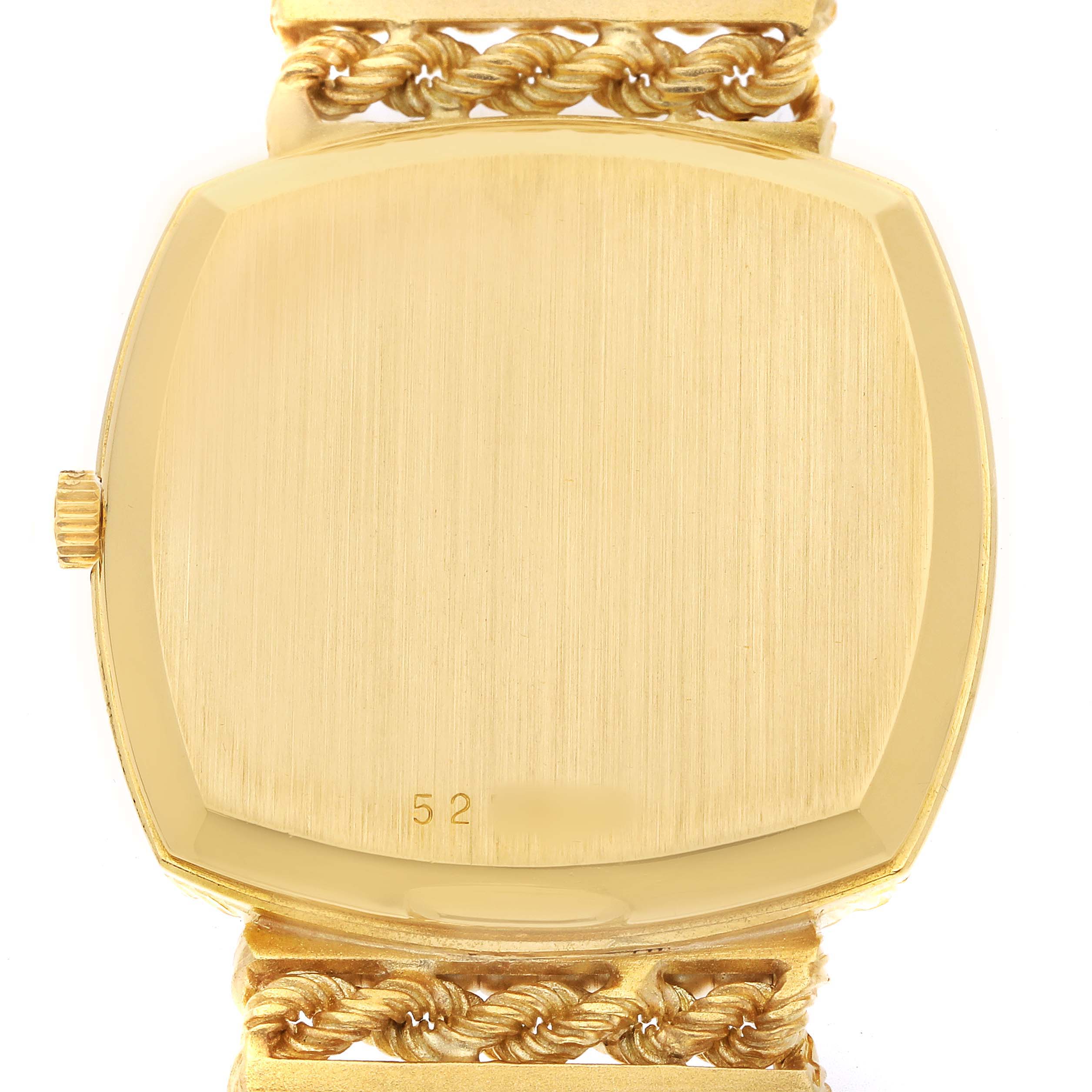 The image shows the back of a Vintage Vacheron Constantin watch with a gold case and intricate gold bracelet detailing.
