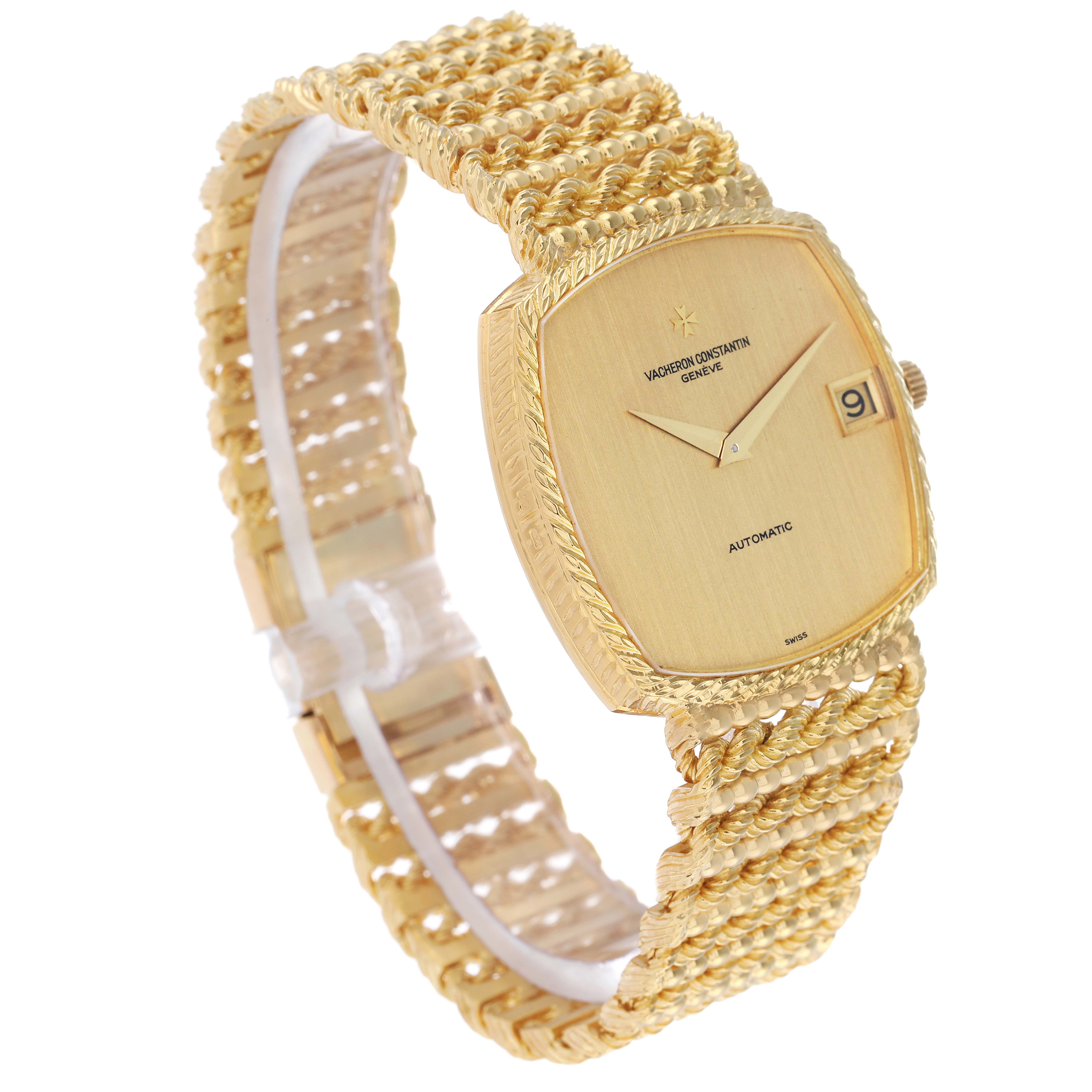 The Vintage Vacheron Constantin watch is shown at a three-quarter angle, highlighting its gold case, woven bracelet, and date display.