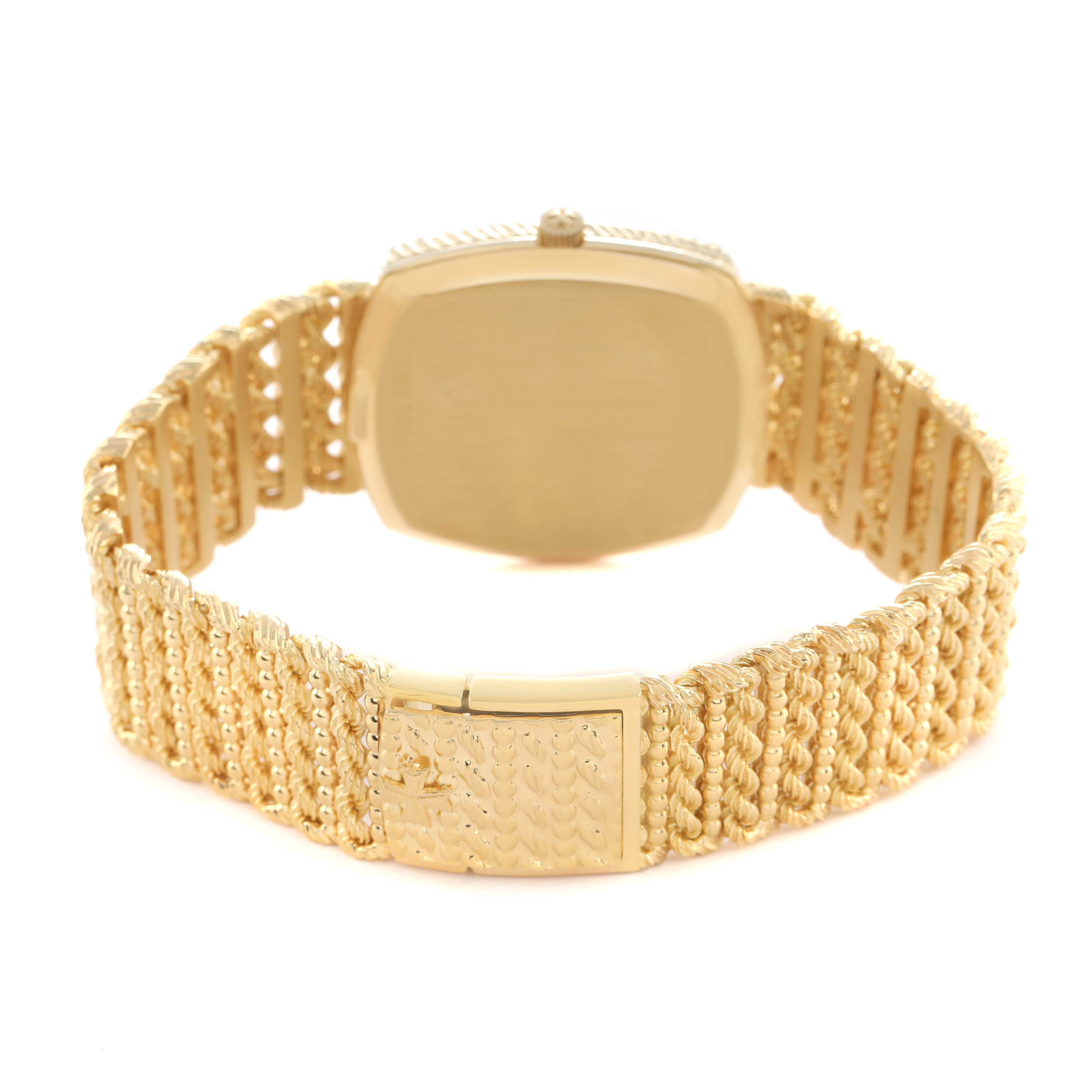 The image shows the back view of a Vintage Vacheron Constantin watch, focusing on its clasp and textured gold bracelet.
