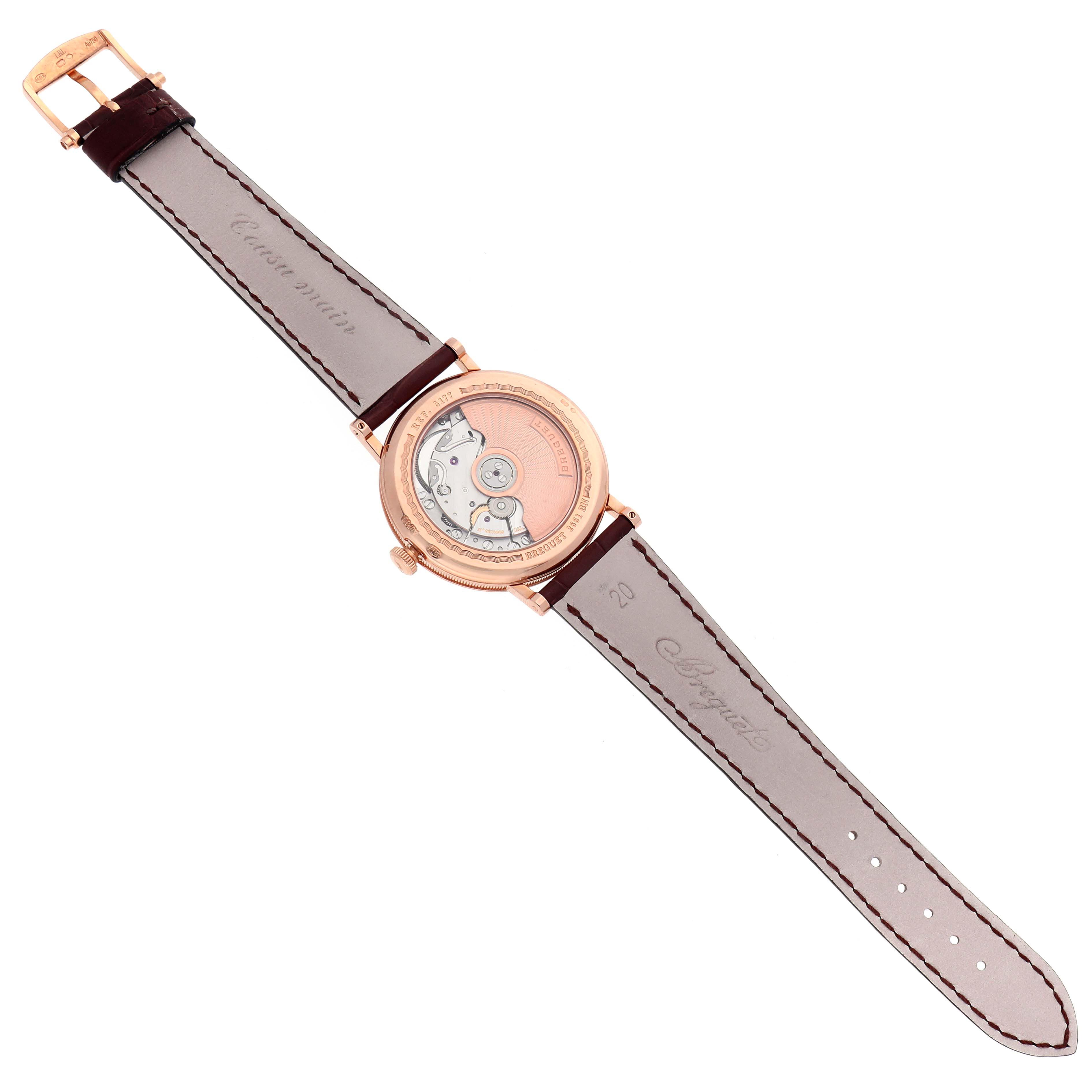 The image shows the back view of the Breguet Classique 5177BR/12/9V6 Men's Rose Gold Silver Dial 5177BR/12/9V6 Men's Rose Gold Silver Dial watch, revealing its movement and leather strap.