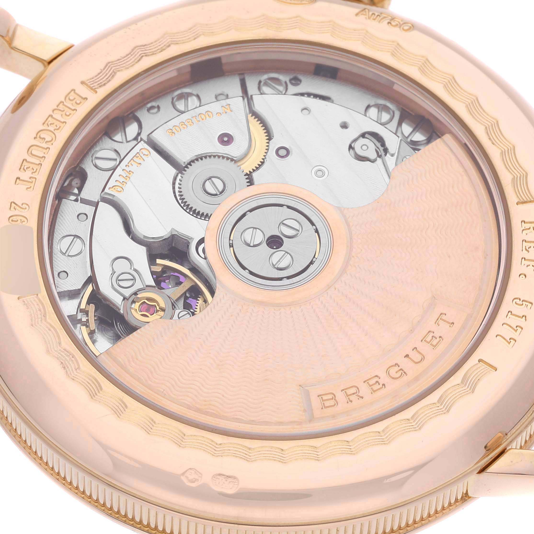 This image shows the intricate movement through the case back of a Breguet Classique 5177BR/12/9V6 Men's Rose Gold Silver Dial 5177BR/12/9V6 Men's Rose Gold Silver Dial model watch.