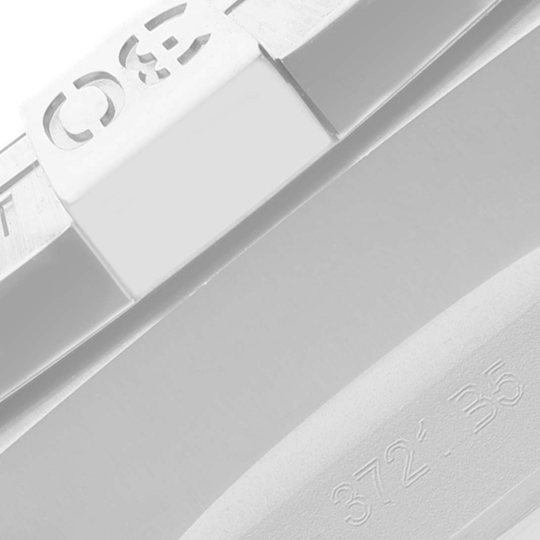 This close-up image of a Breitling Avenger A13317101B1X1 Men's Stainless Steel Black Dial A13317101B1X1 Men's Stainless Steel Black Dial watch shows part of the bezel and a portion of the strap.