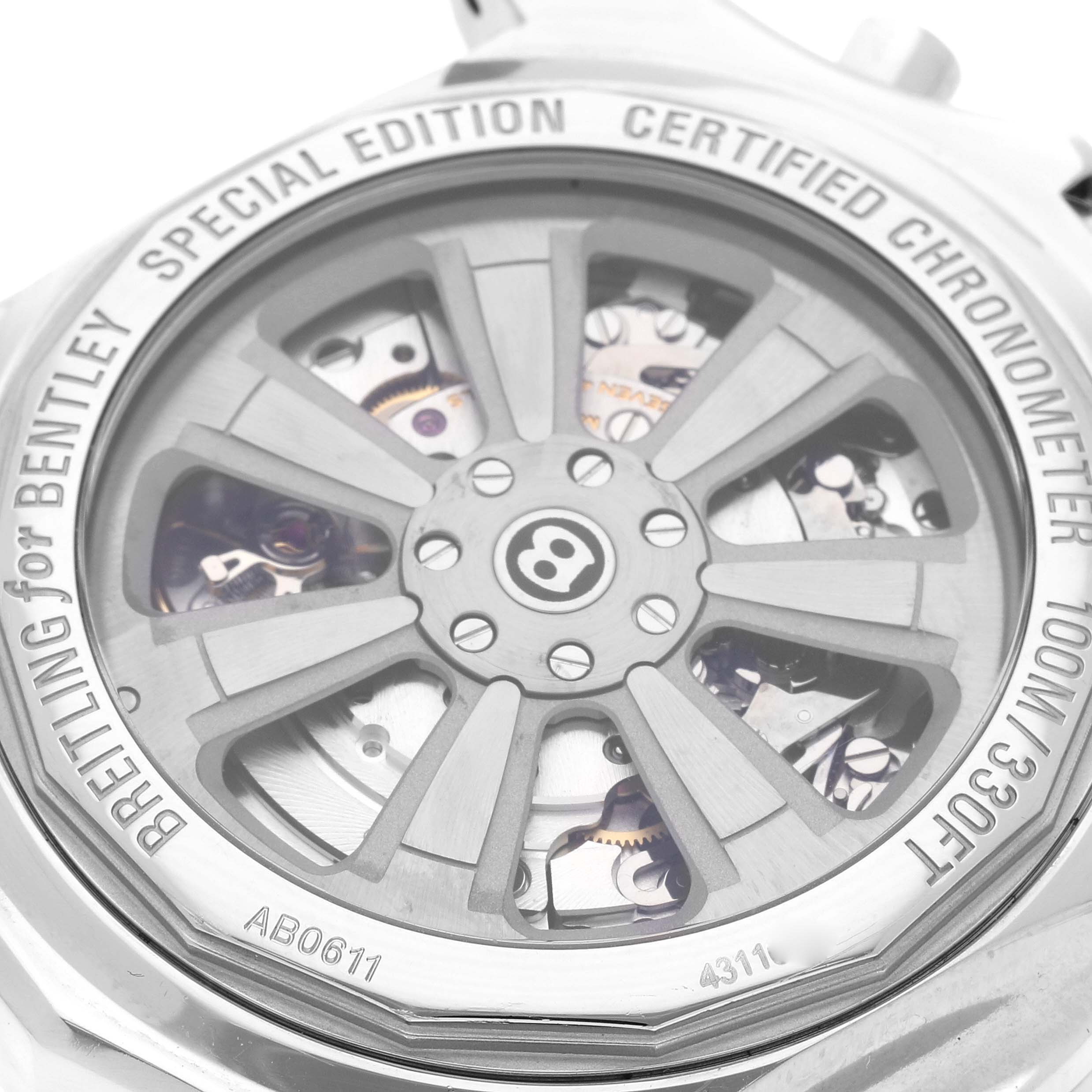 The image shows the back of a Breitling for Bentley watch, revealing the inner mechanical parts through a transparent case, engraved with branding and specifications.