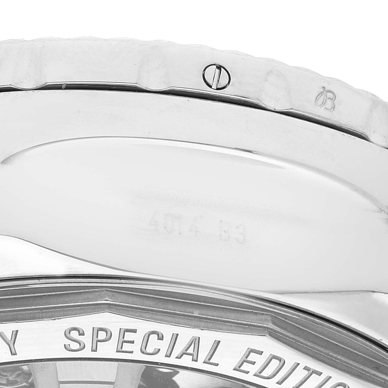 The image shows a close-up view of the bezel and case back of a Bentley model by Breitling watch.