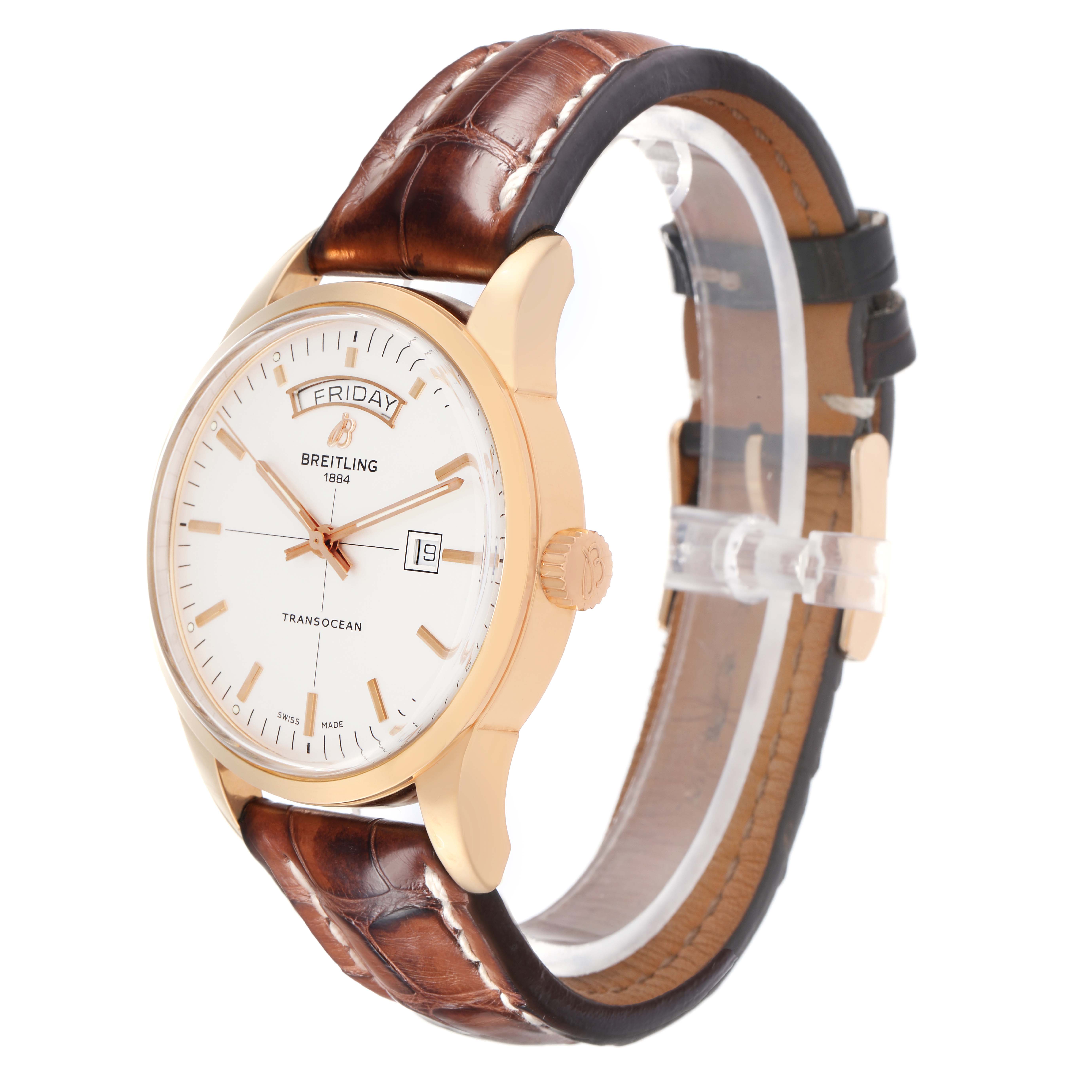 The Breitling Transocean R45310 Men
s Rose Gold Silver Dial watch is shown at an angled side view, displaying the face, crown, and brown leather strap.
