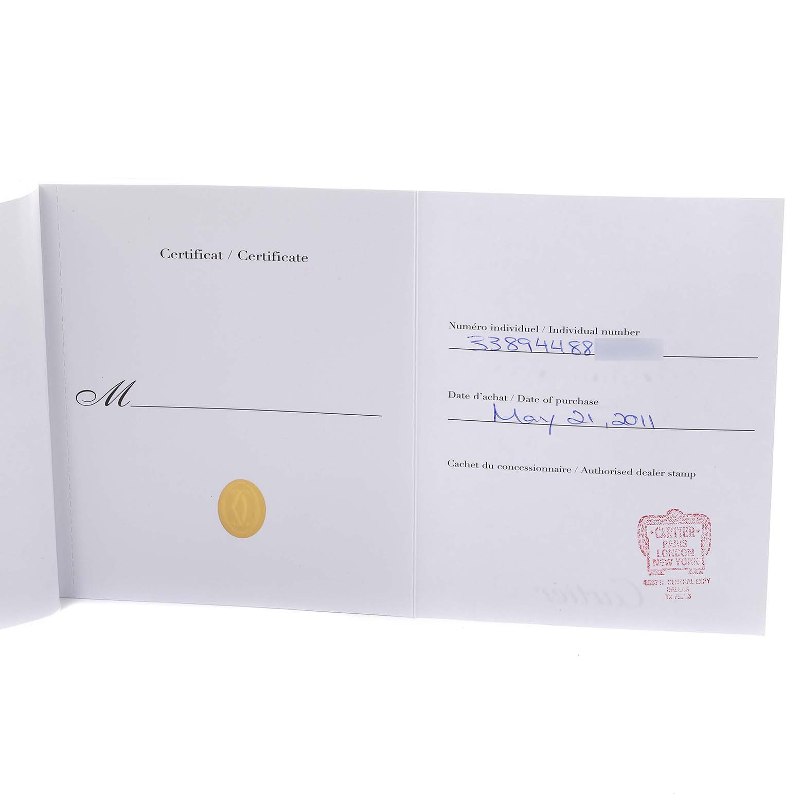 The image shows a certificate for the Calibre de Cartier watch by Cartier from an open book angle.