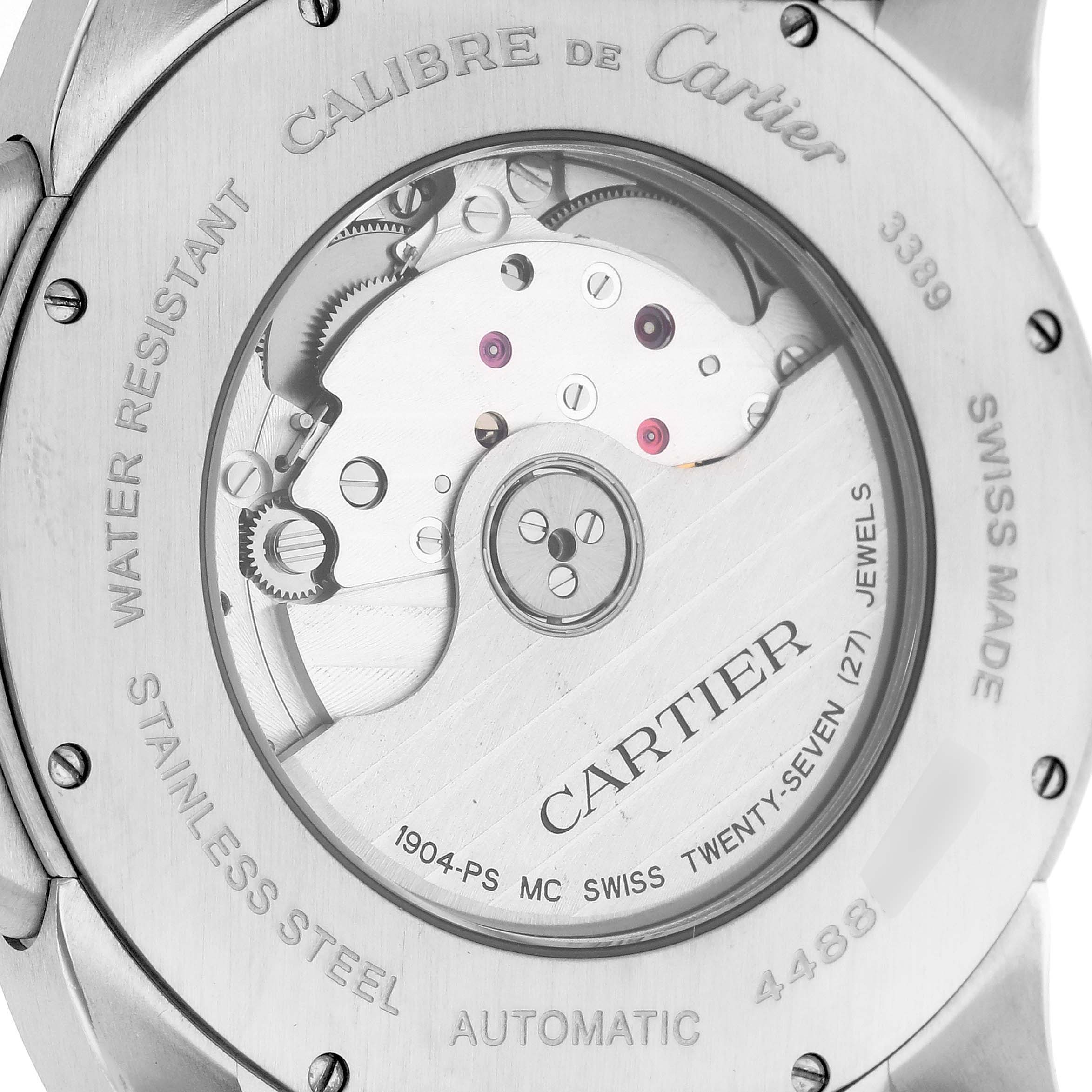 The image shows the back casing of a Calibre de Cartier watch, highlighting its automatic movement and inscriptions.