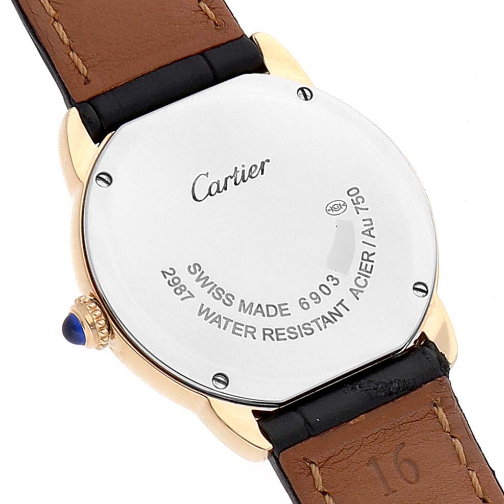 The image shows the back case and part of the leather strap of the Cartier Ronde W6700355 Women's Steel and Gold (two tone) Silver Dial W6700355 Women's Steel and Gold (two tone) Silver Dial watch.