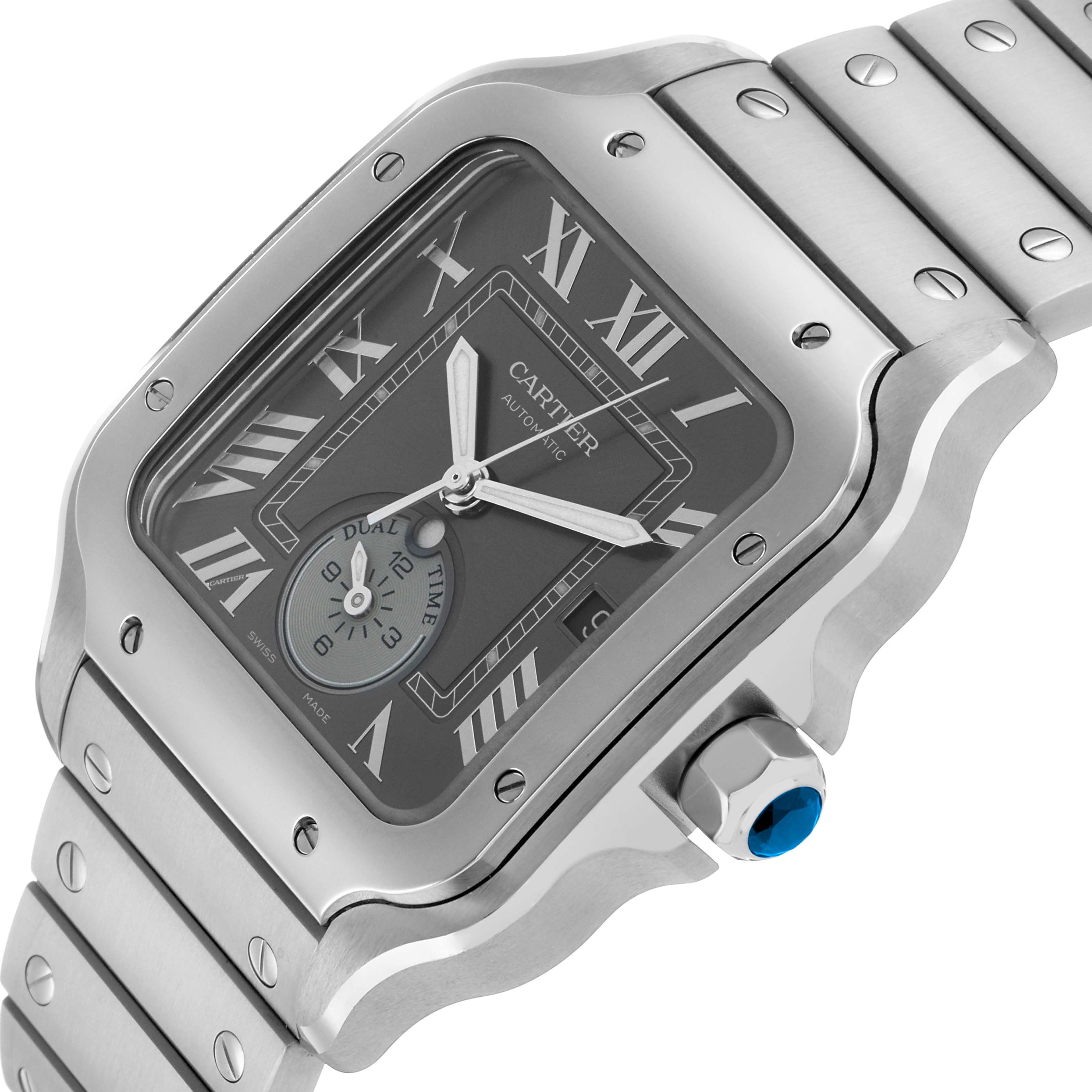The image shows a close-up of the Cartier Santos WSSA0076 Men's Stainless Steel Grey Dial watch, highlighting the face, bezel, crown, and part of the bracelet.