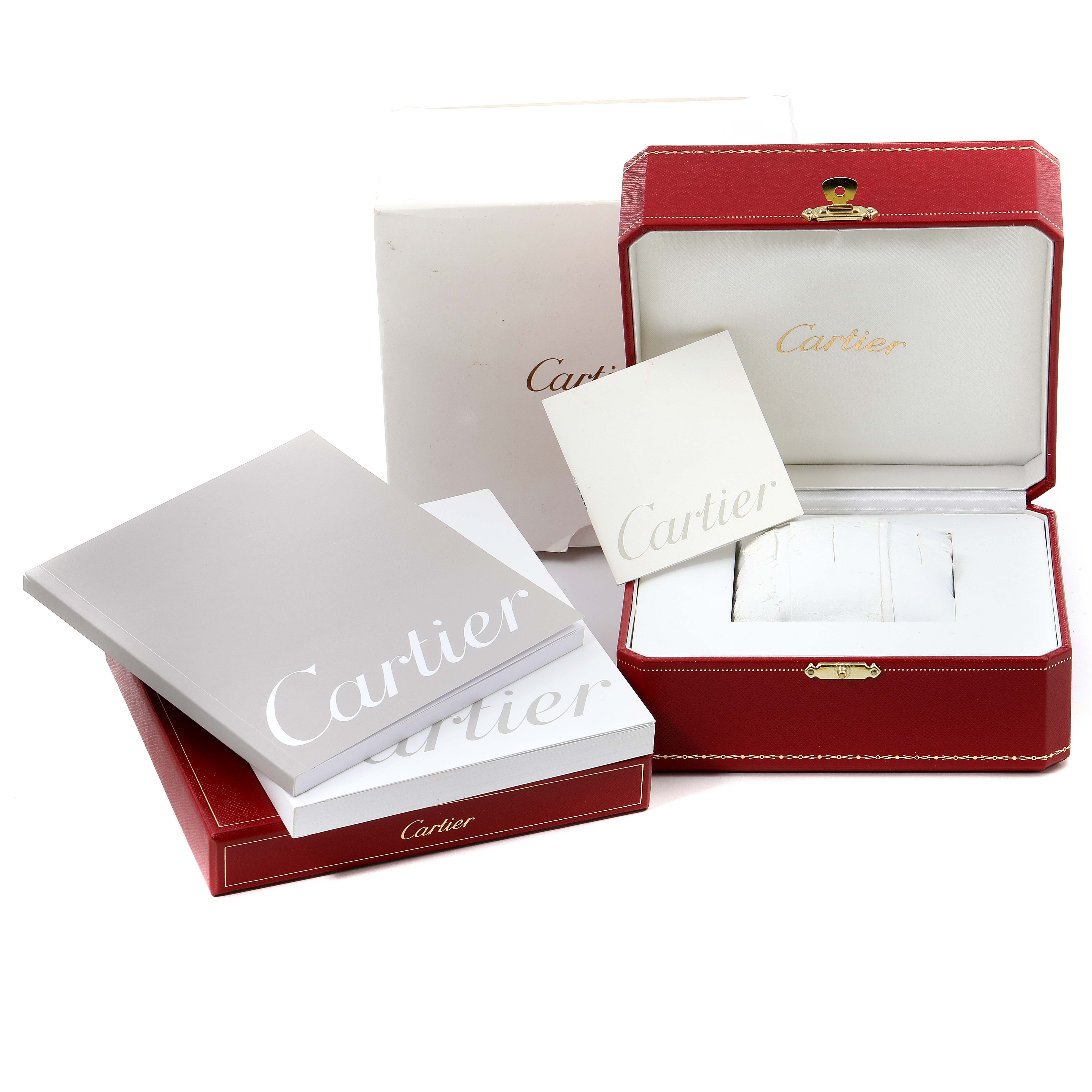 This image shows the packaging, manuals, and presentation box for the Cartier Santos W20099C4 Men's Stainless Steel Silver Dial W20099C4 Men's Stainless Steel Silver Dial watch.