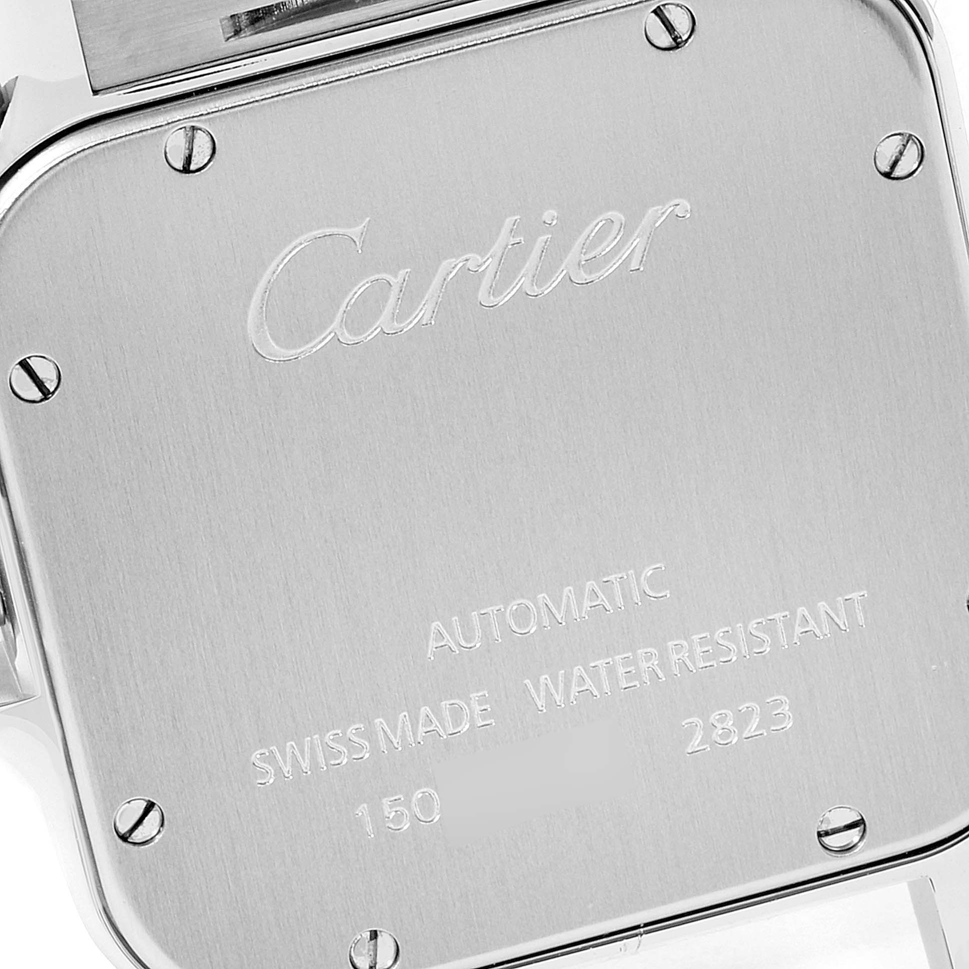 The image shows the back case of a Cartier Santos W20099C4 Men's Stainless Steel Silver Dial W20099C4 Men's Stainless Steel Silver Dial watch with engraved details and visible screws.