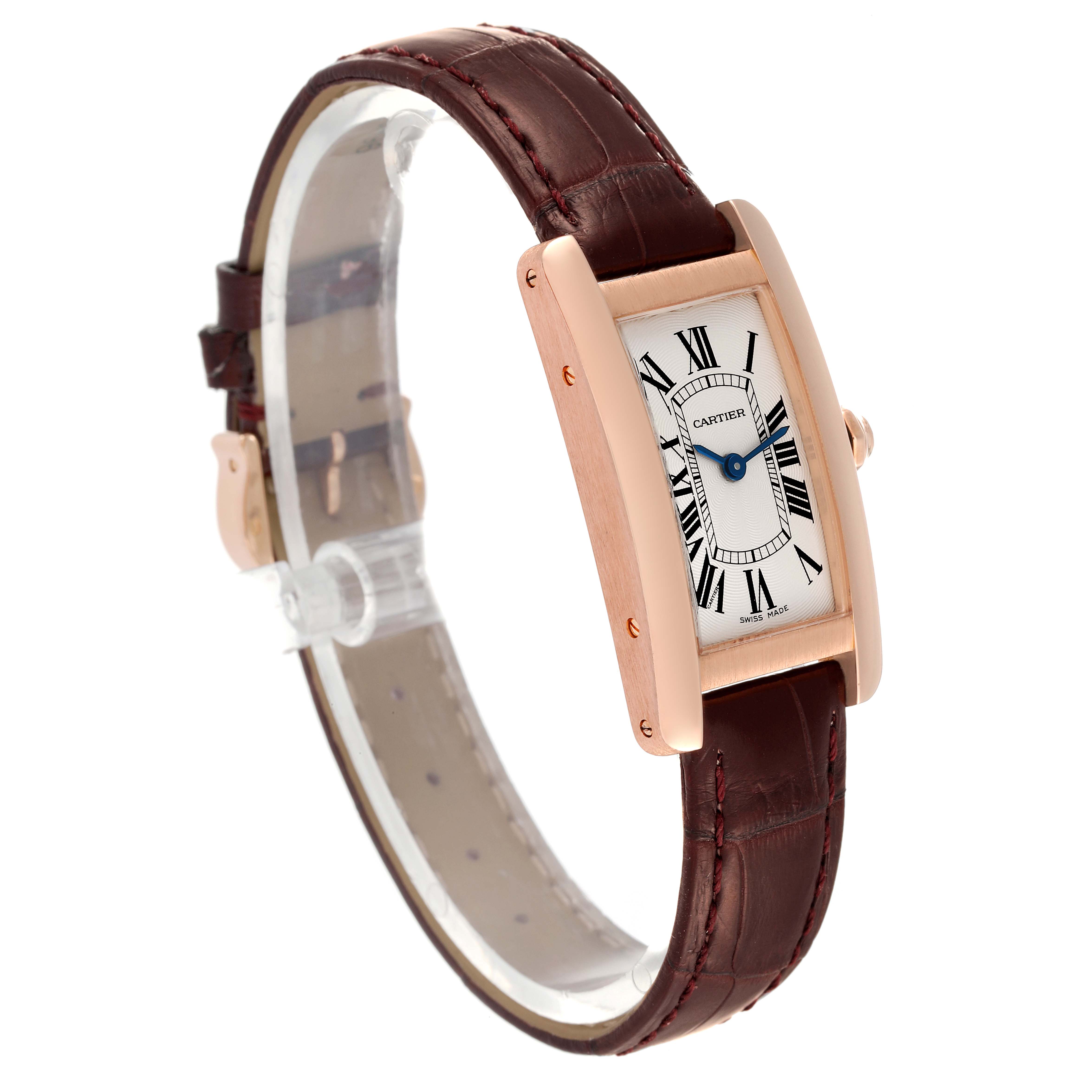 The image shows a Cartier Tank Américaine watch at a slight angle, highlighting its rectangular dial, rose gold case, and brown leather strap.