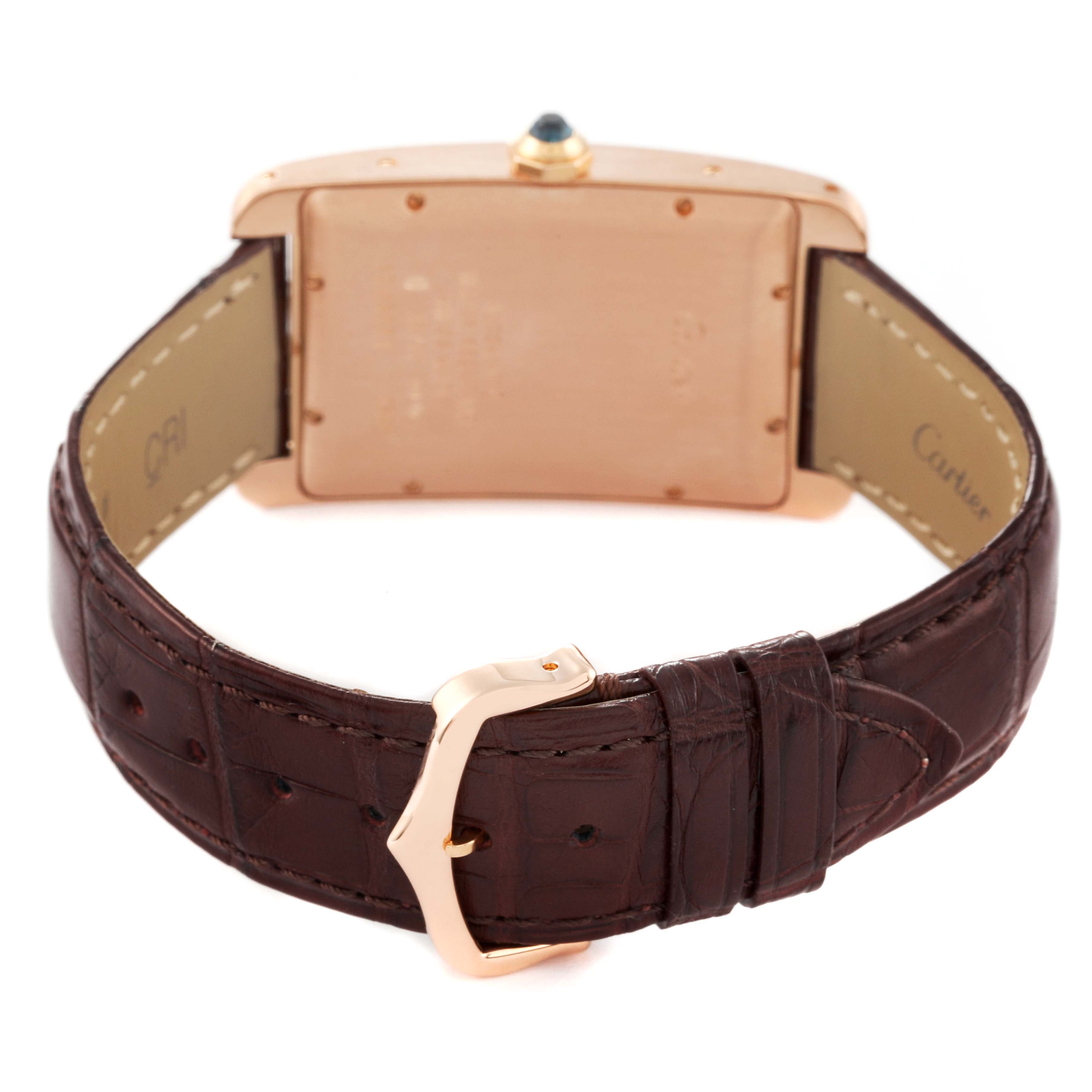 The image shows the back view of the Cartier Tank Americaine W2609156 Men
s Rose Gold Silver Dial W2609156 Men
s Rose Gold Silver Dial watch, highlighting the leather strap and the buckle.
