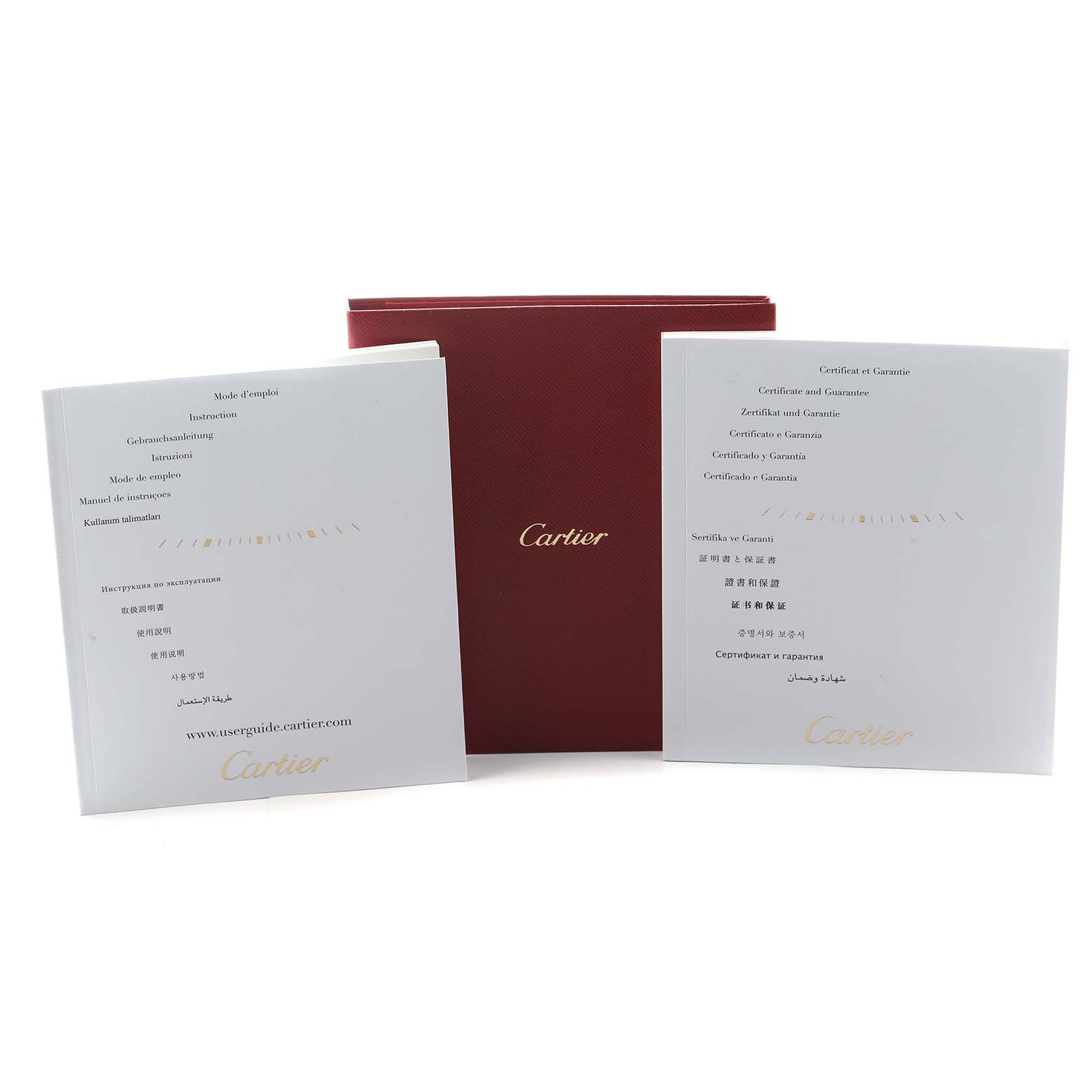 The image shows a Cartier Tank Américaine watch package including manuals and a red Cartier box from a front angle.