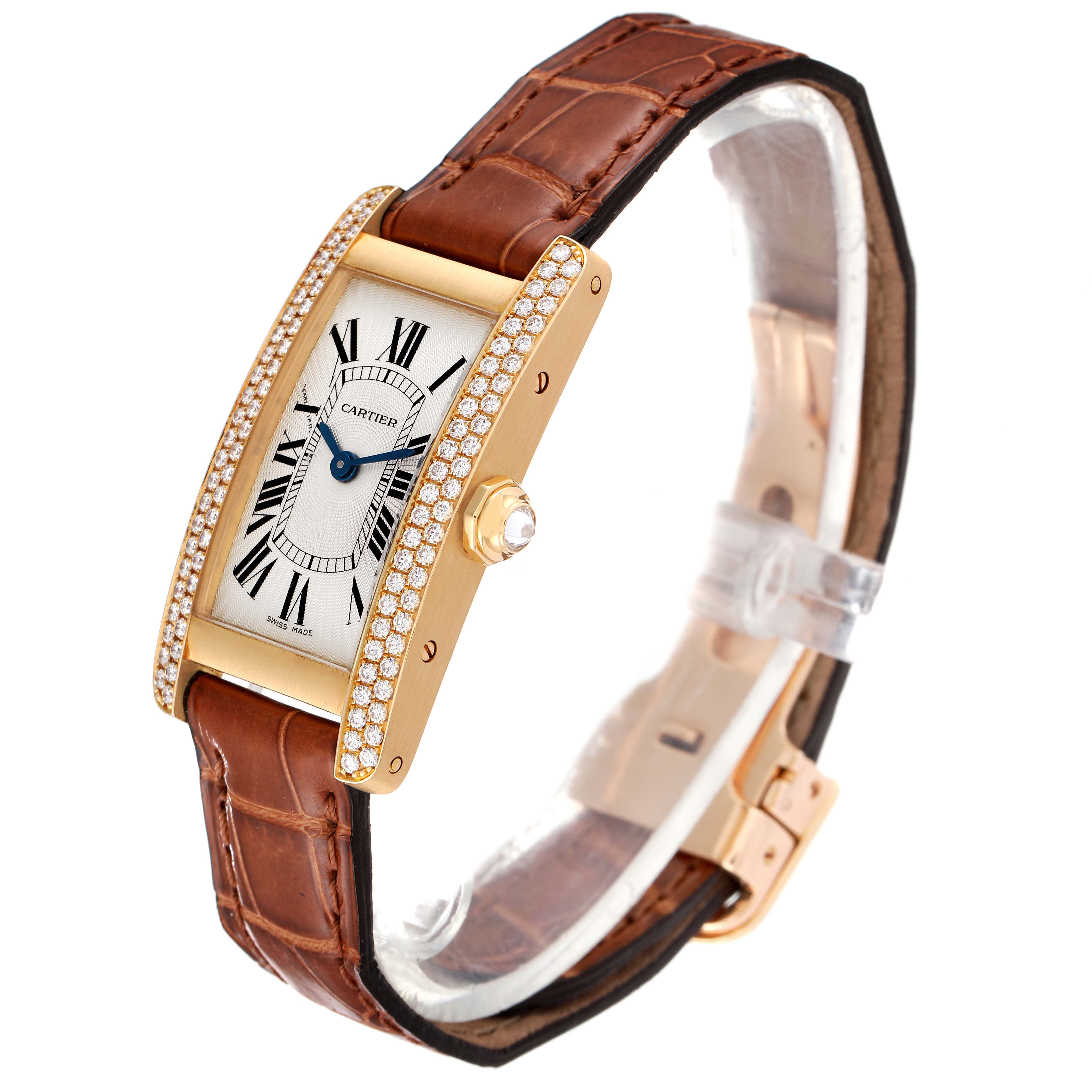 The image shows a Cartier Tank Americaine WB701251 Women's Yellow Gold Silver Dial WB701251 Women's Yellow Gold Silver Dial watch from a three-quarter angle, highlighting the face, band, and side crown.
