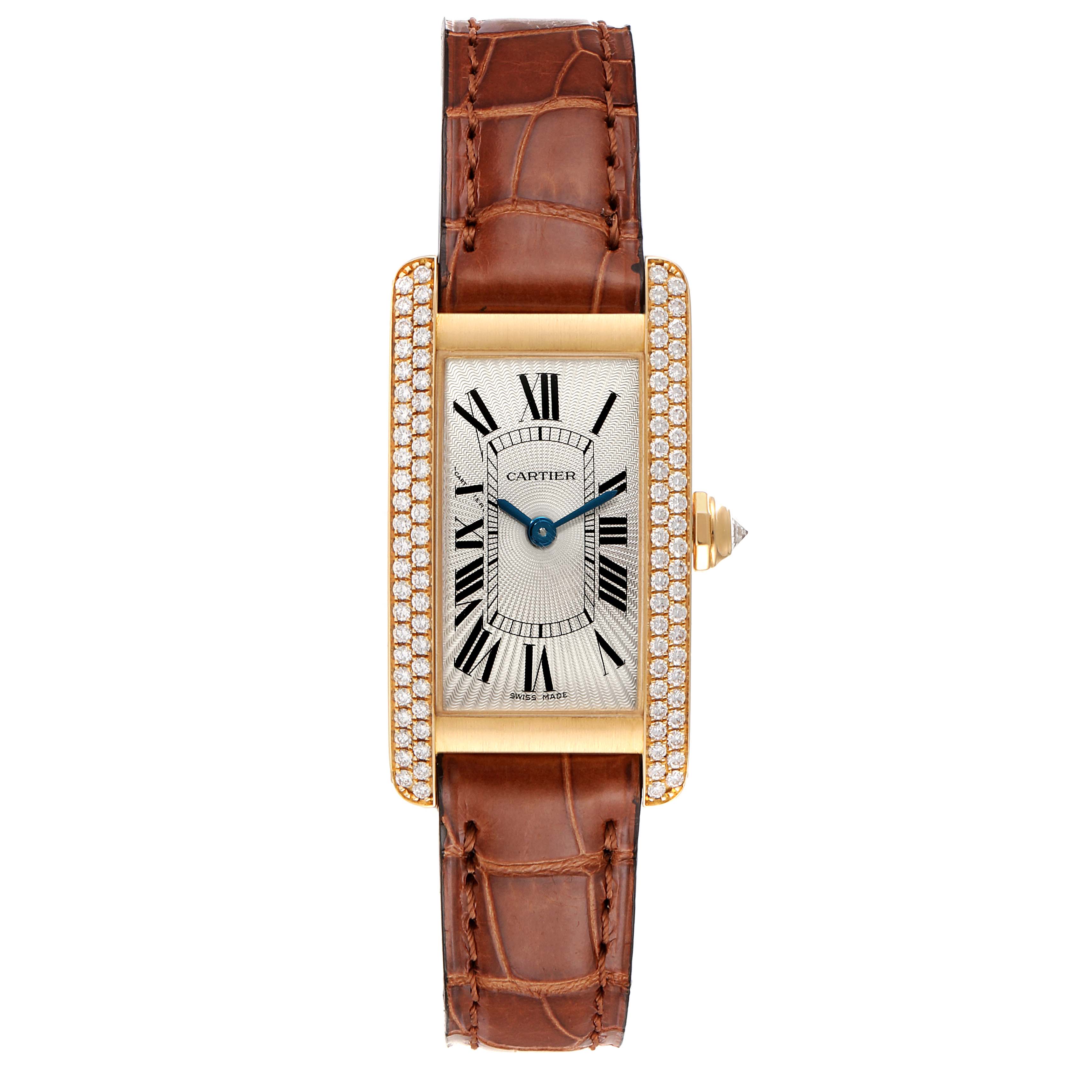 The Cartier Tank Américaine watch is shown from a top-down angle, featuring its rectangular face, diamond bezel, and brown leather strap.
