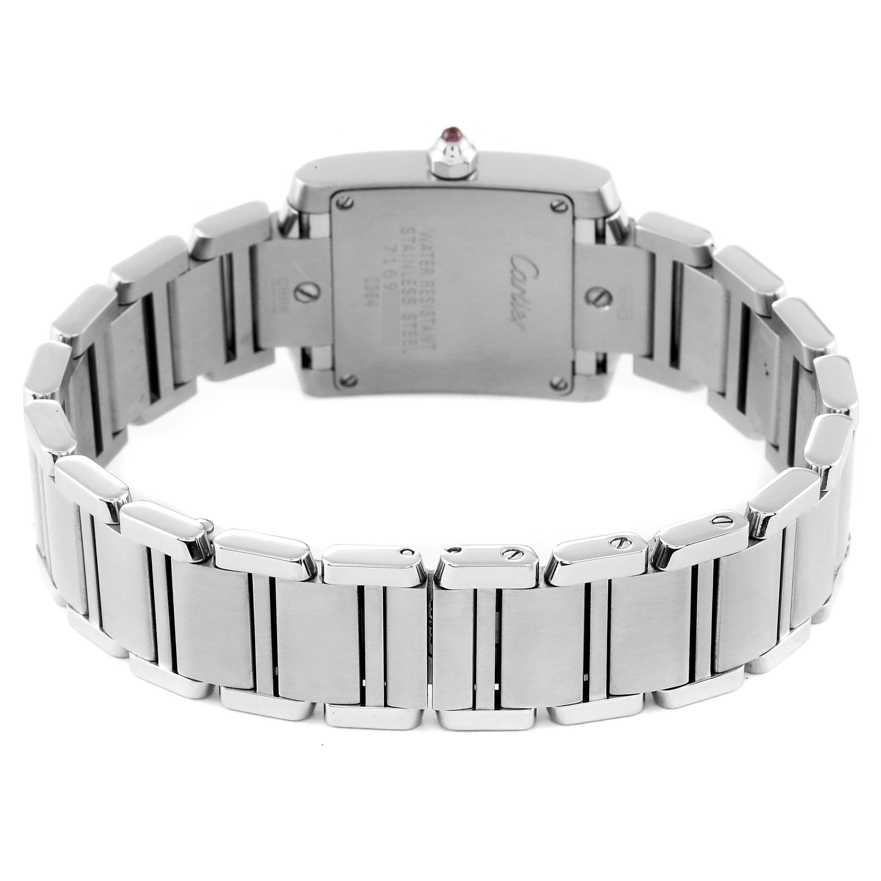 This image shows the back view of a Cartier Tank Française watch, focusing on the case back and stainless steel bracelet.