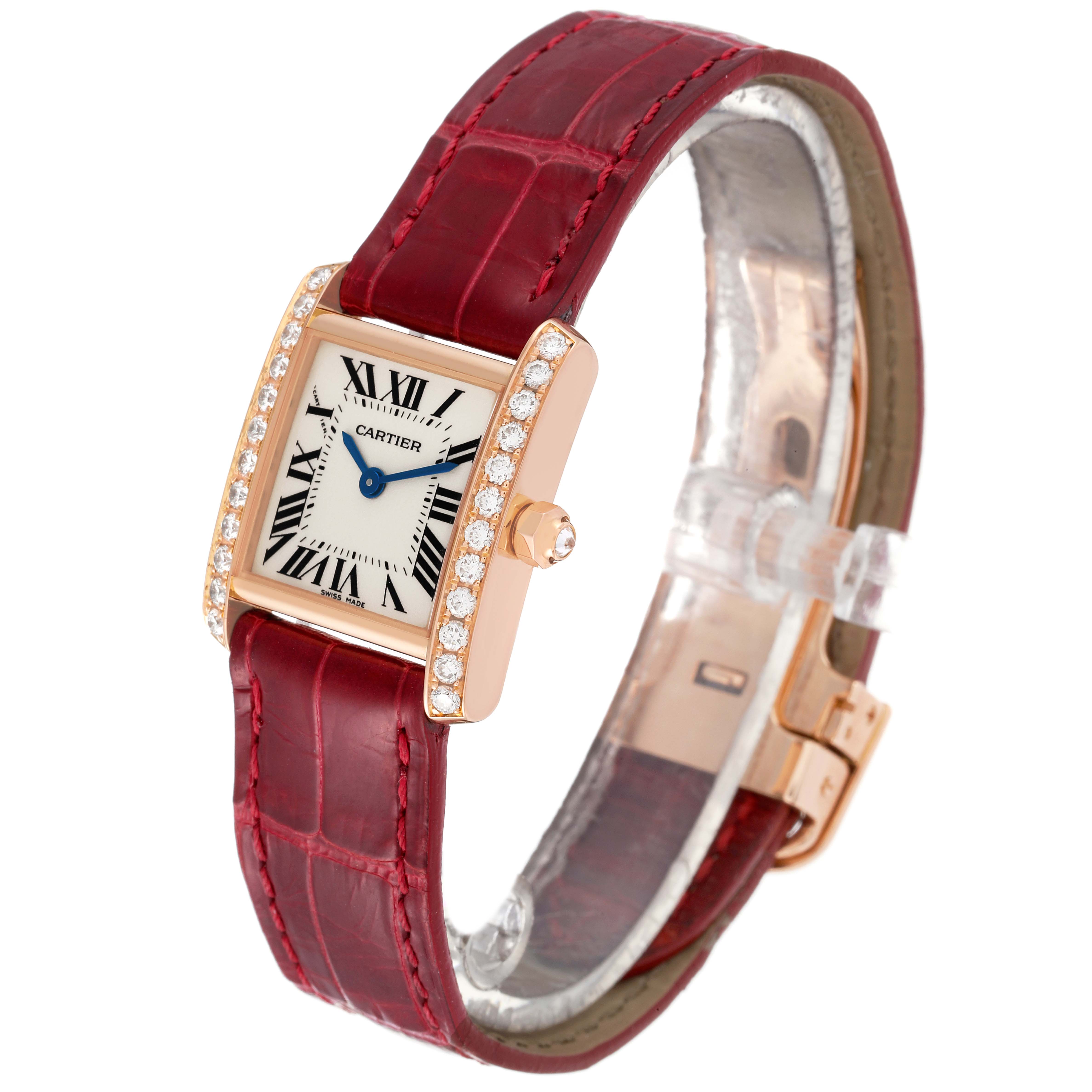 The image shows a Cartier Tank Francaise WE104531 Women's Rose Gold Silver Dial WE104531 Women's Rose Gold Silver Dial watch with a red leather strap, viewed from a front-left angle.