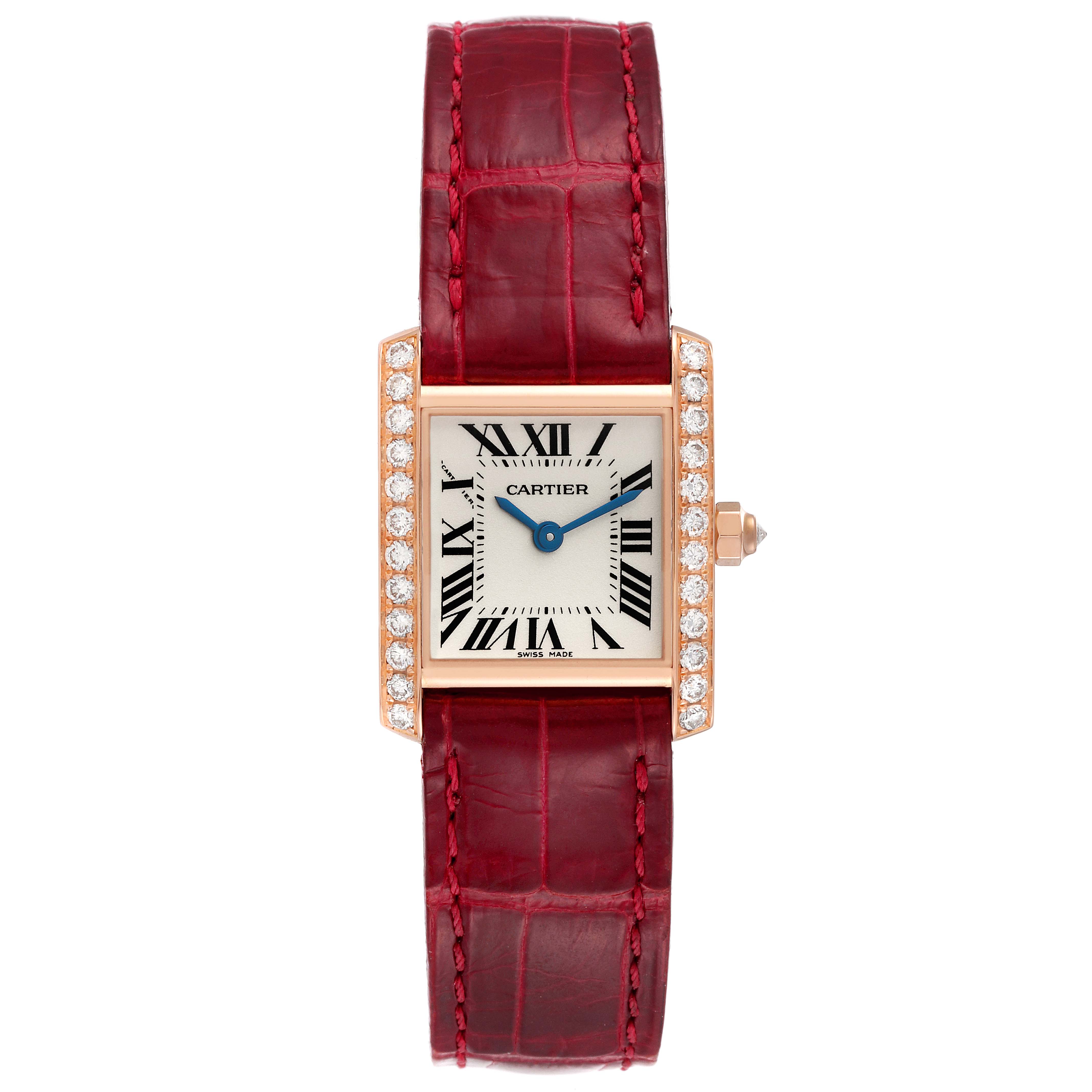 The Cartier Tank Francaise WE104531 Women's Rose Gold Silver Dial WE104531 Women's Rose Gold Silver Dial watch is shown from a top-down angle, displaying its dial, case, and red leather strap.