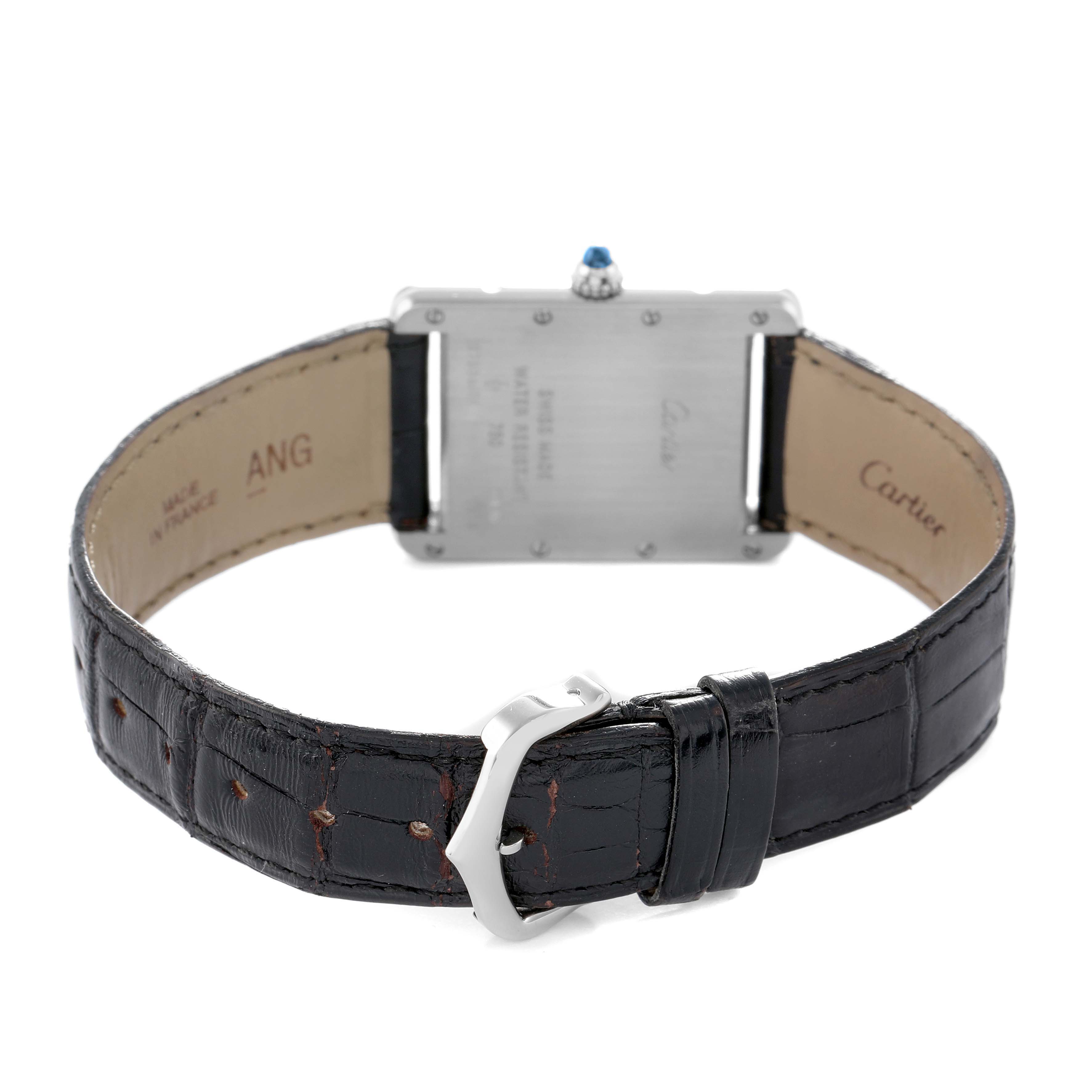 The image shows the back of a Cartier Tank Louis W1540956 Men's White Gold Silver Dial watch, displaying the clasp, leather strap, and case back.